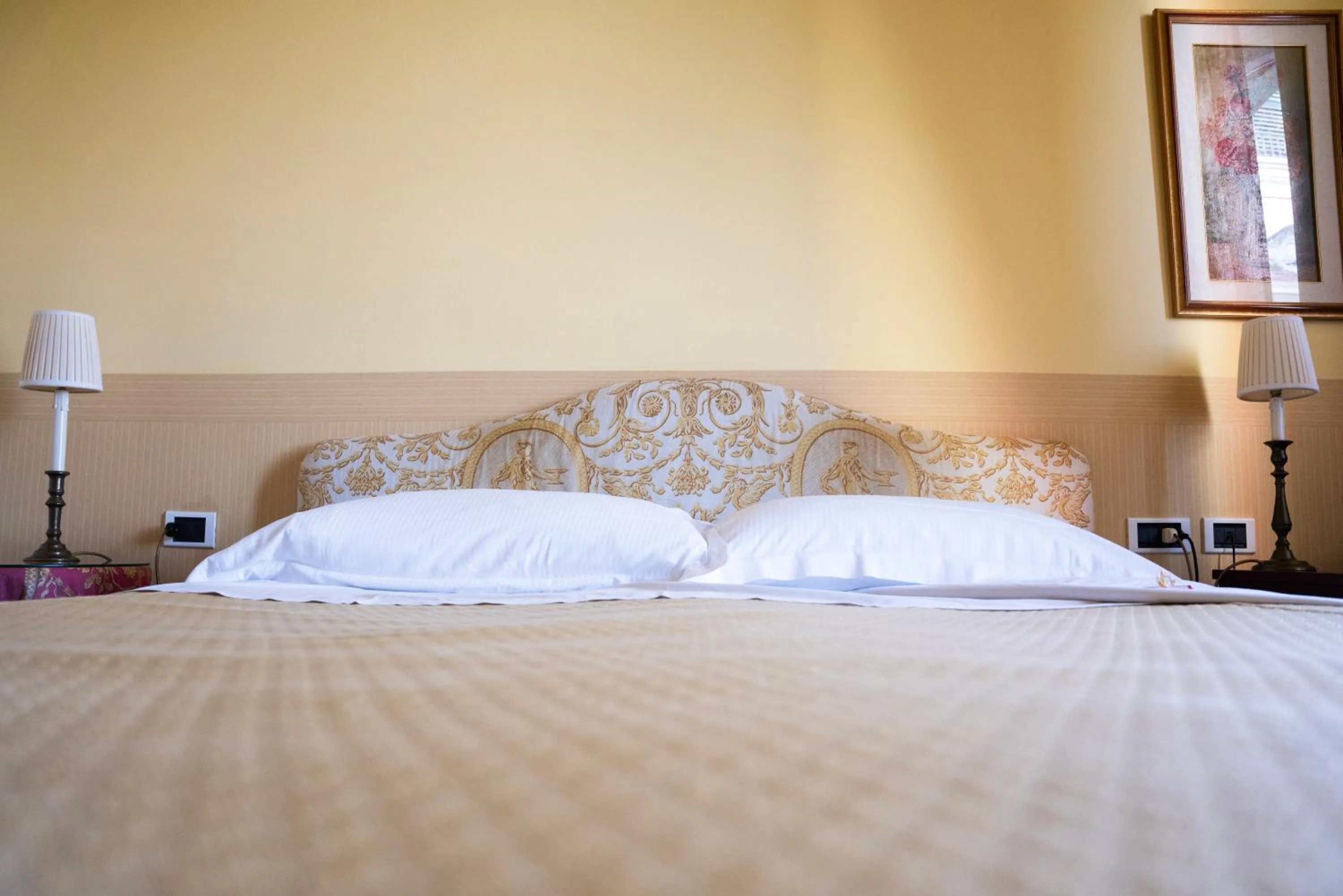 Bed in Relais Villa Pomela