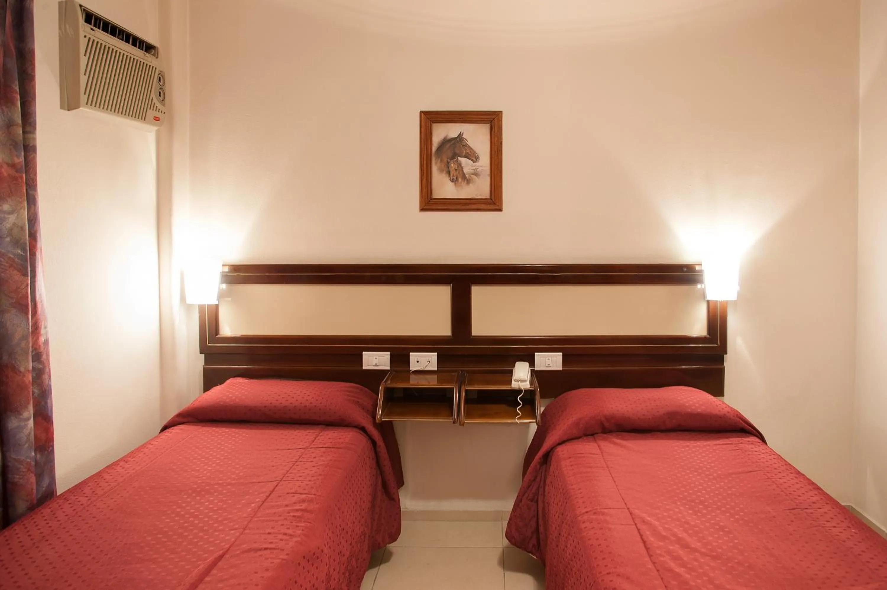 Bed in Hotel Carollo