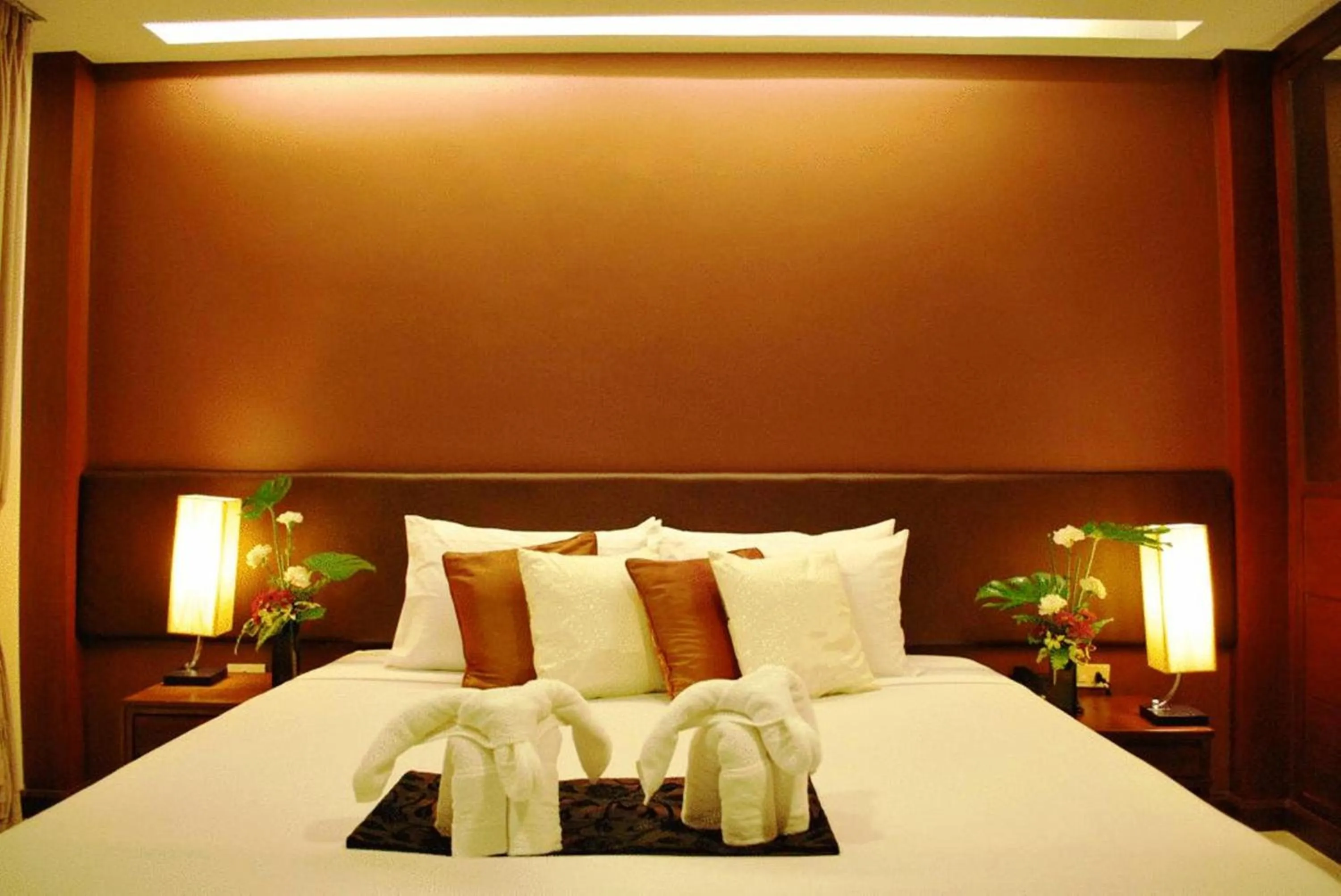Bed in Windmill Resort Hotel Pattaya