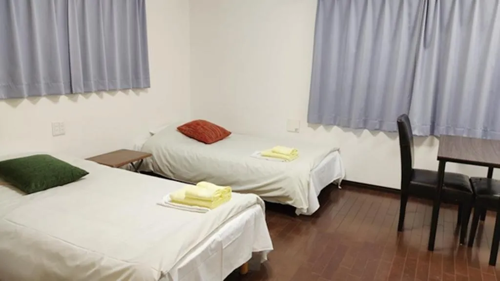 Bed in Hotel Chuo Oasis