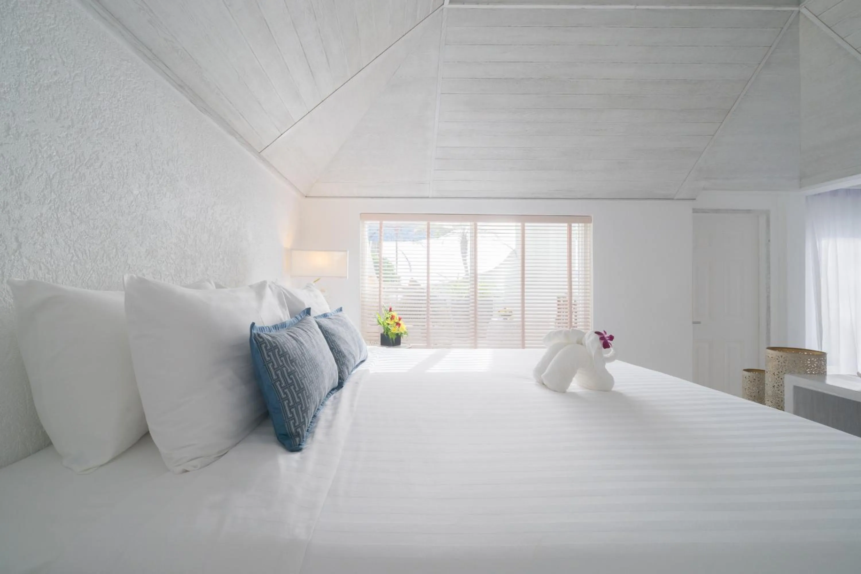 Bed in Ocean Breeze Resort Khaolak