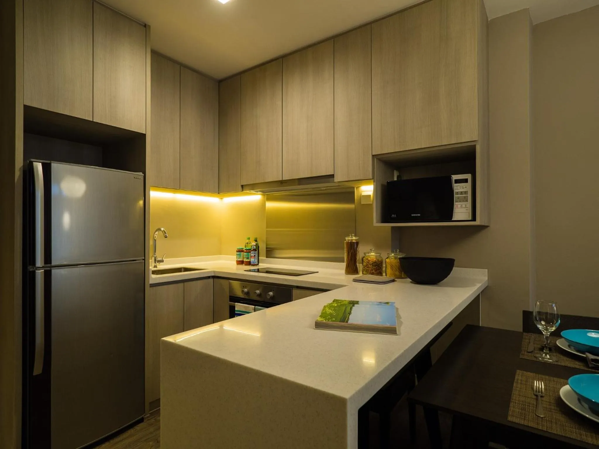 Kitchen or kitchenette in PARKROYAL Serviced Suites Singapore