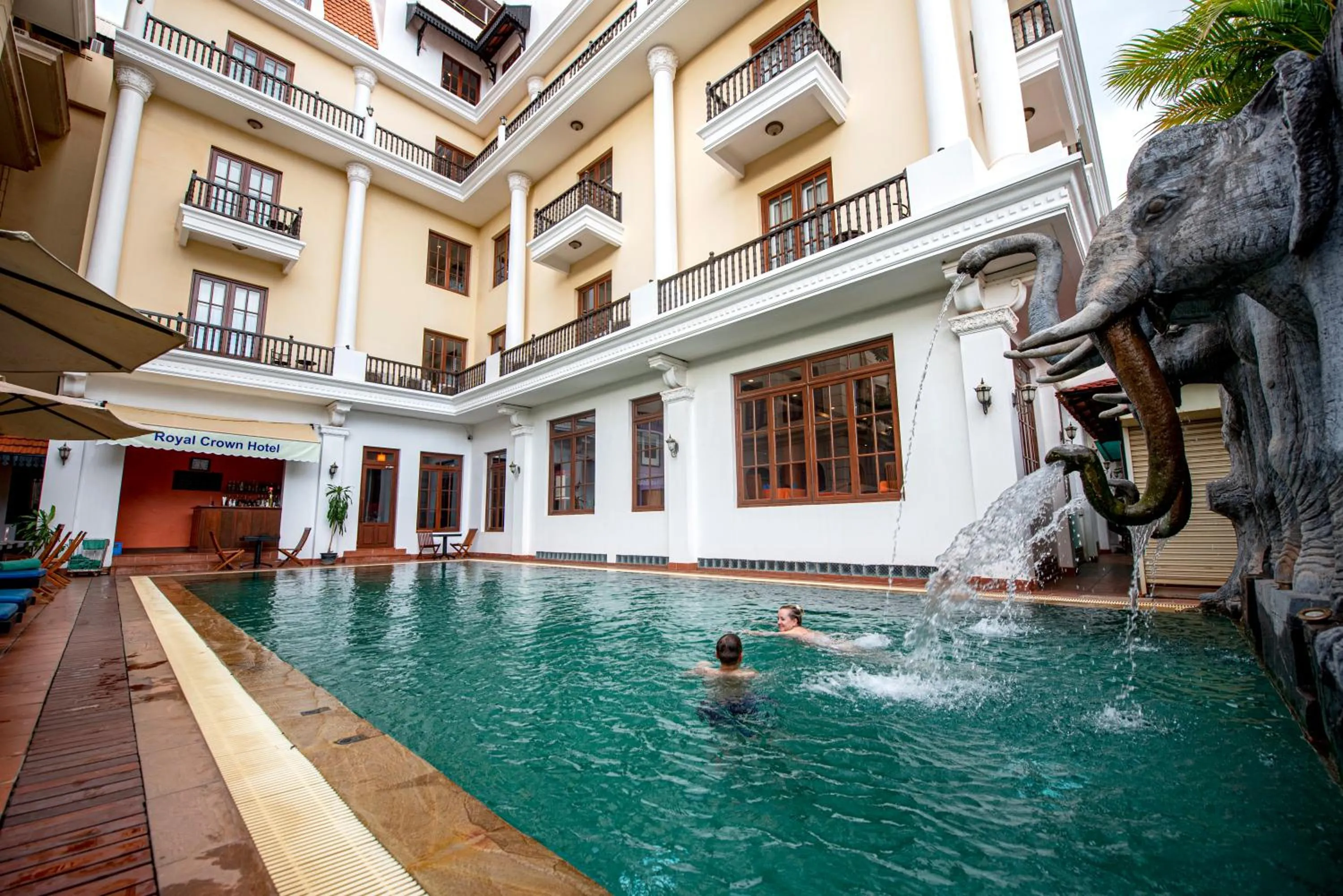 Swimming pool in The Suite By Royal Crown Hotel