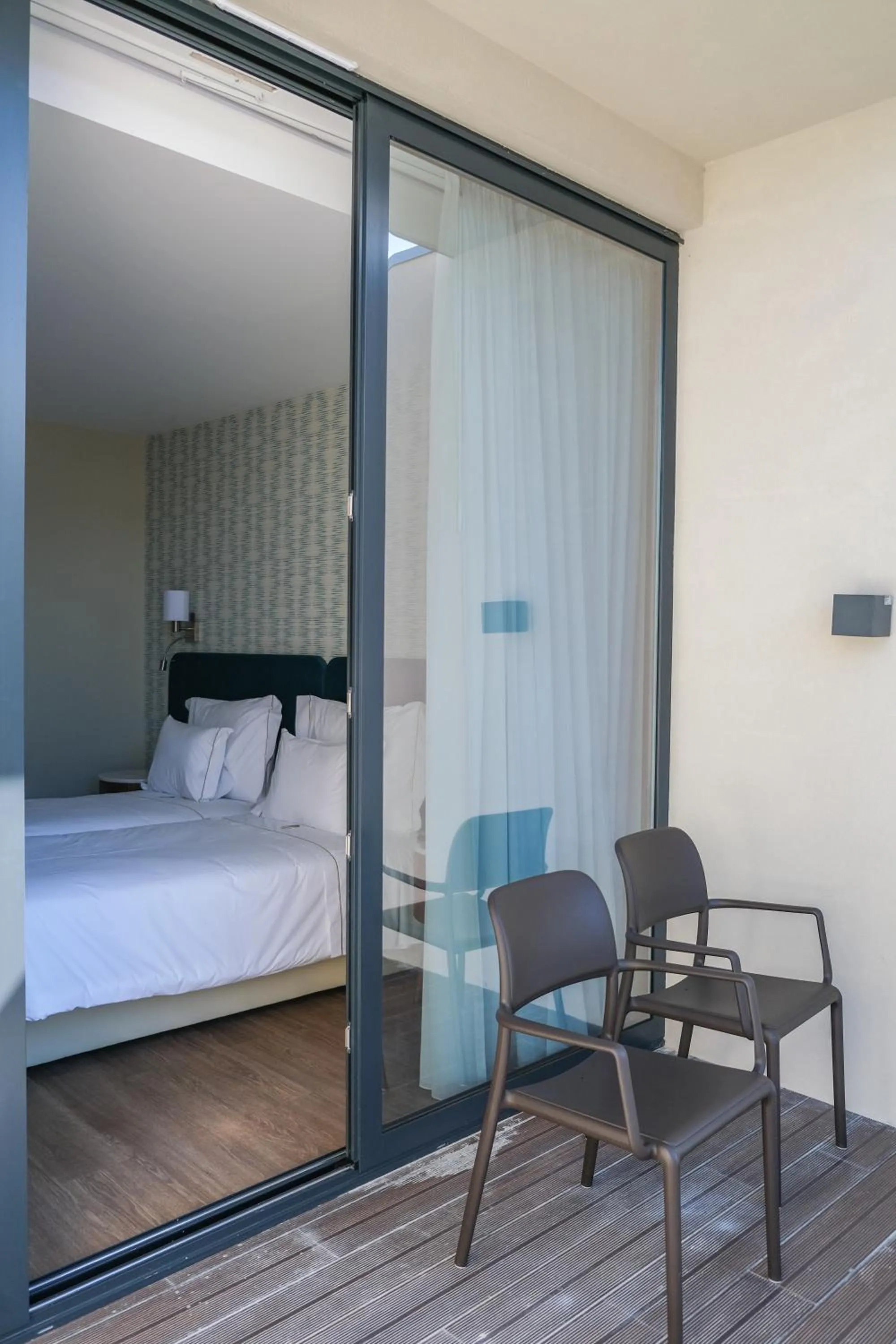 Balcony/Terrace, Bed in Hotel Vouga