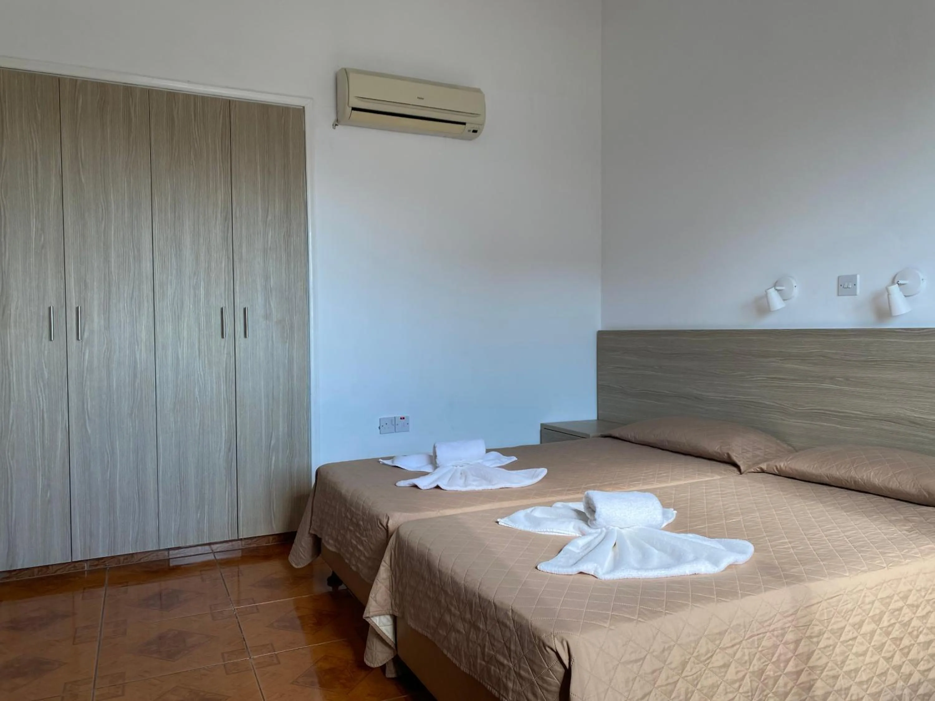 Bed in Alexia Hotel Apartments