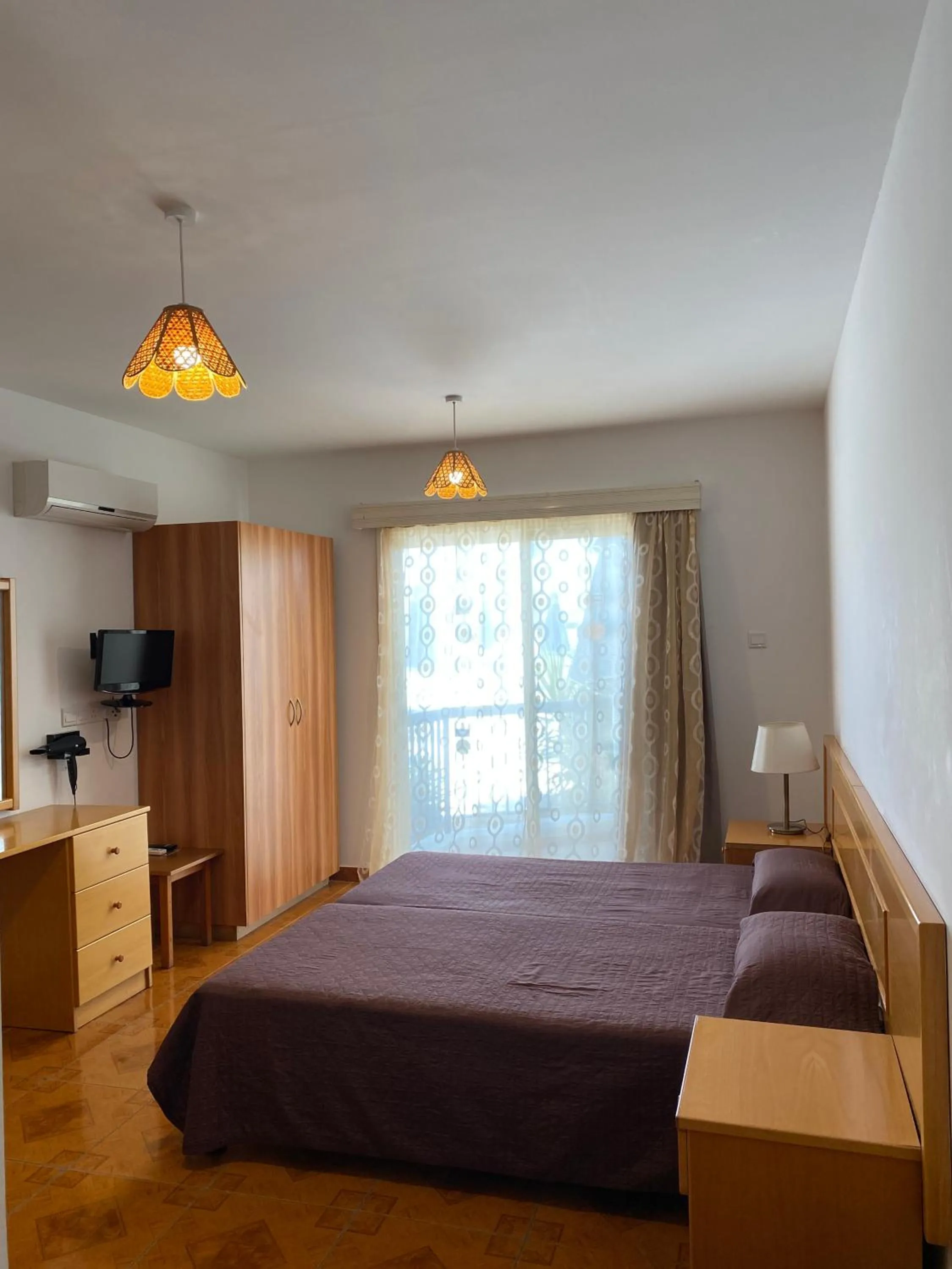 Bed in Alexia Hotel Apartments