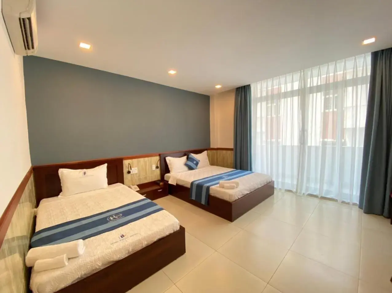 Triple Room with Balcony in Hung Phuoc Hotel Triple Room with Balcony in Hung Phuoc Hotel