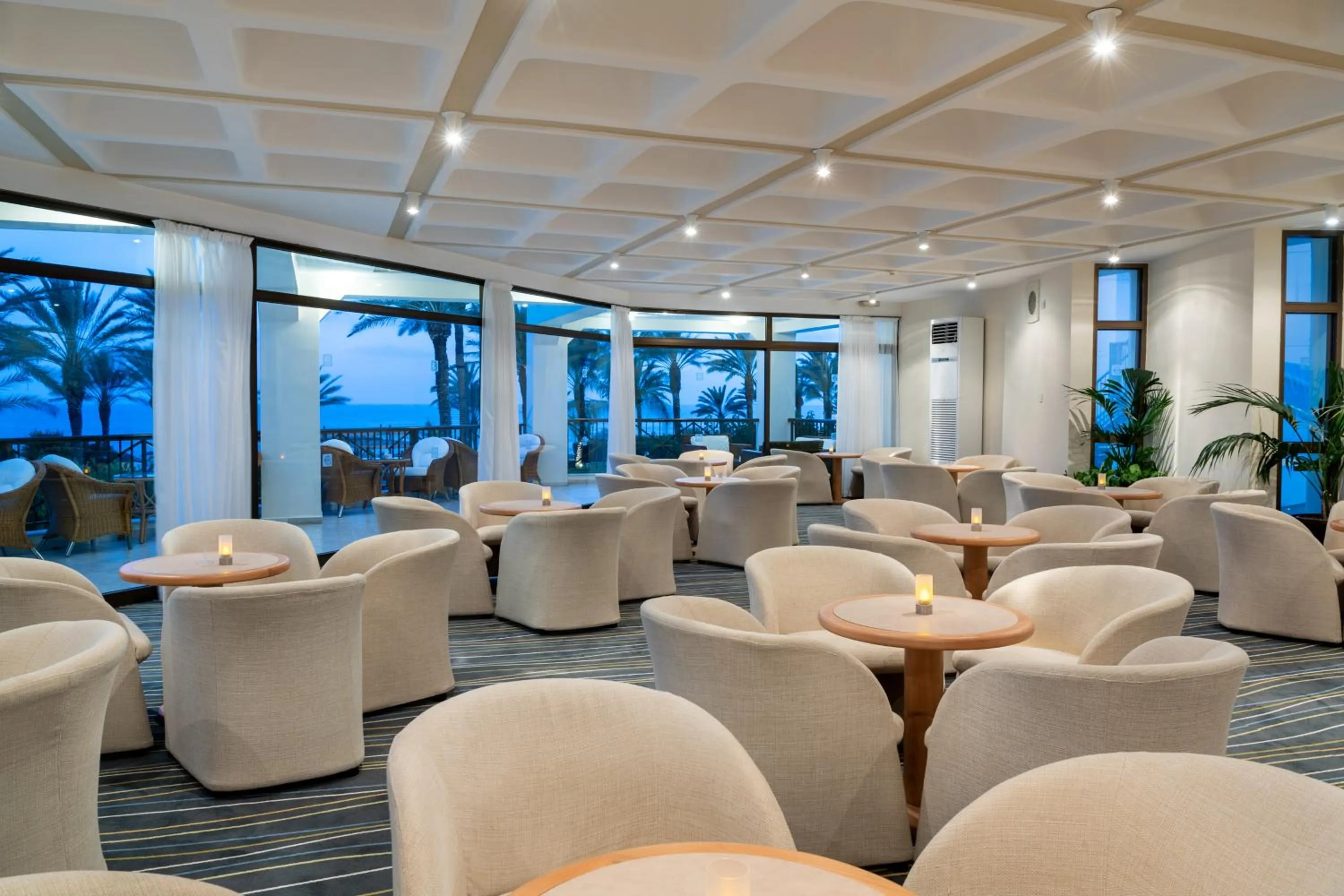 Lounge or bar in Constantinou Bros Athena Beach Hotel