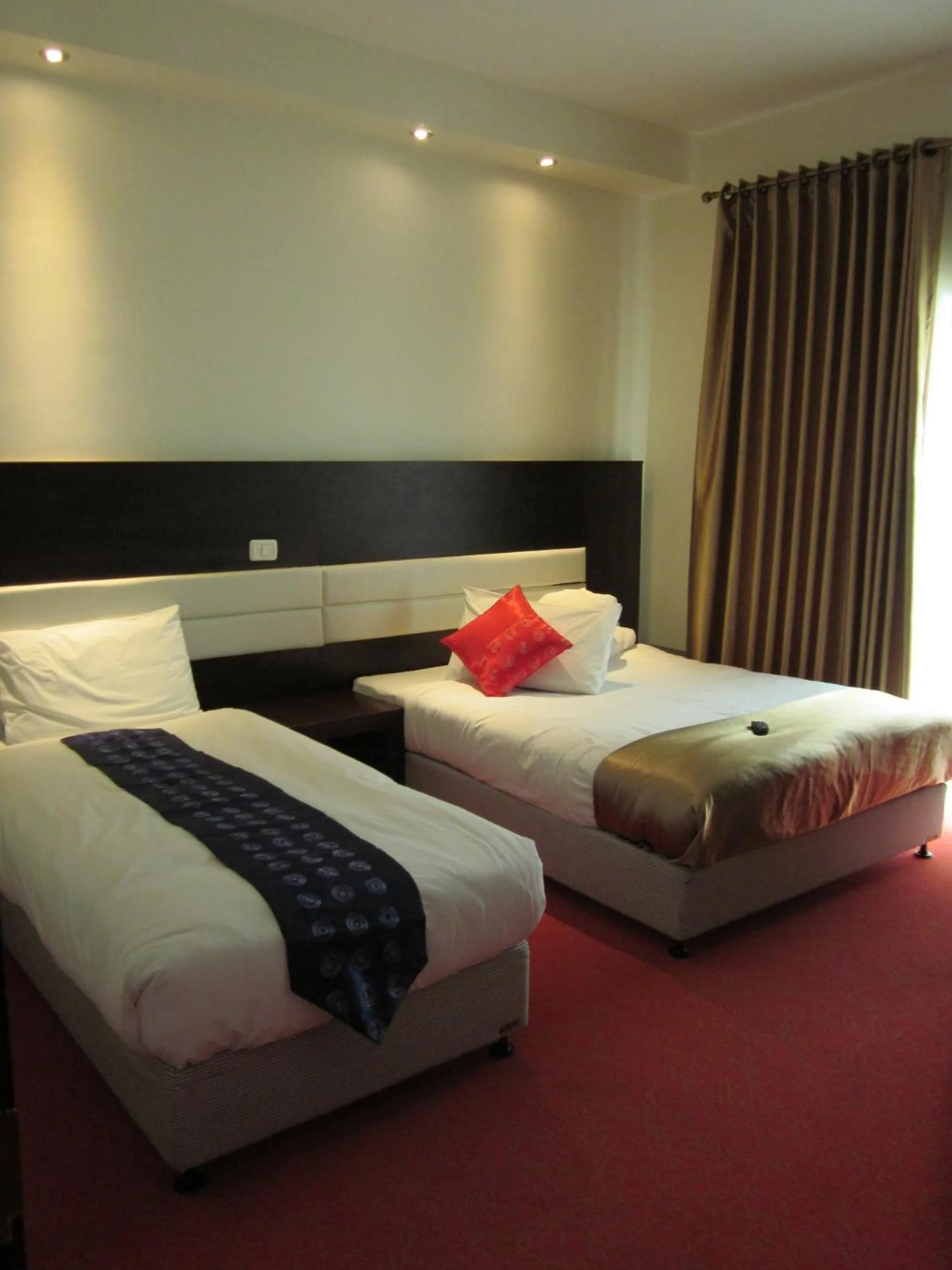 Bed in Commodore Hotel