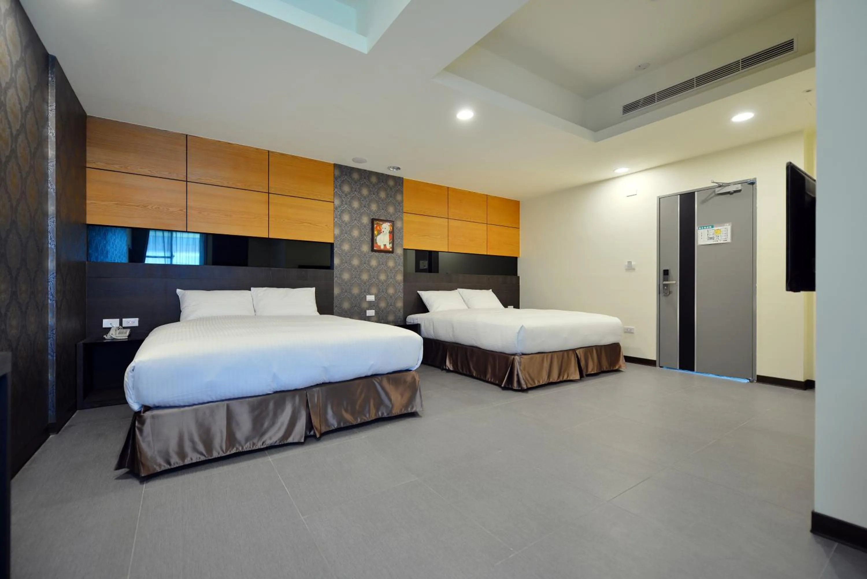 Bed in San Juan Easy Stay Inn Tainan