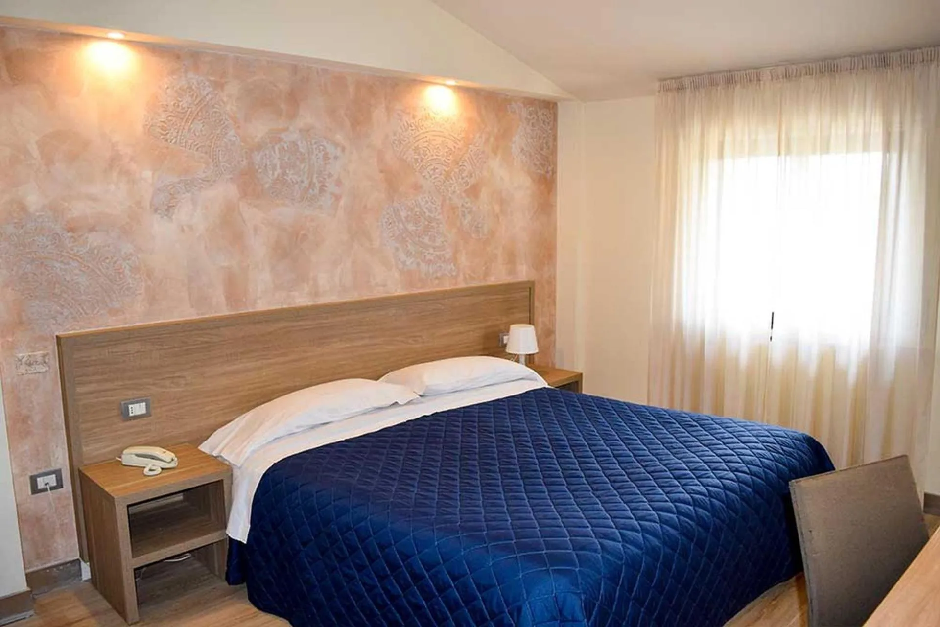 Bedroom in Le Grazie Hotel