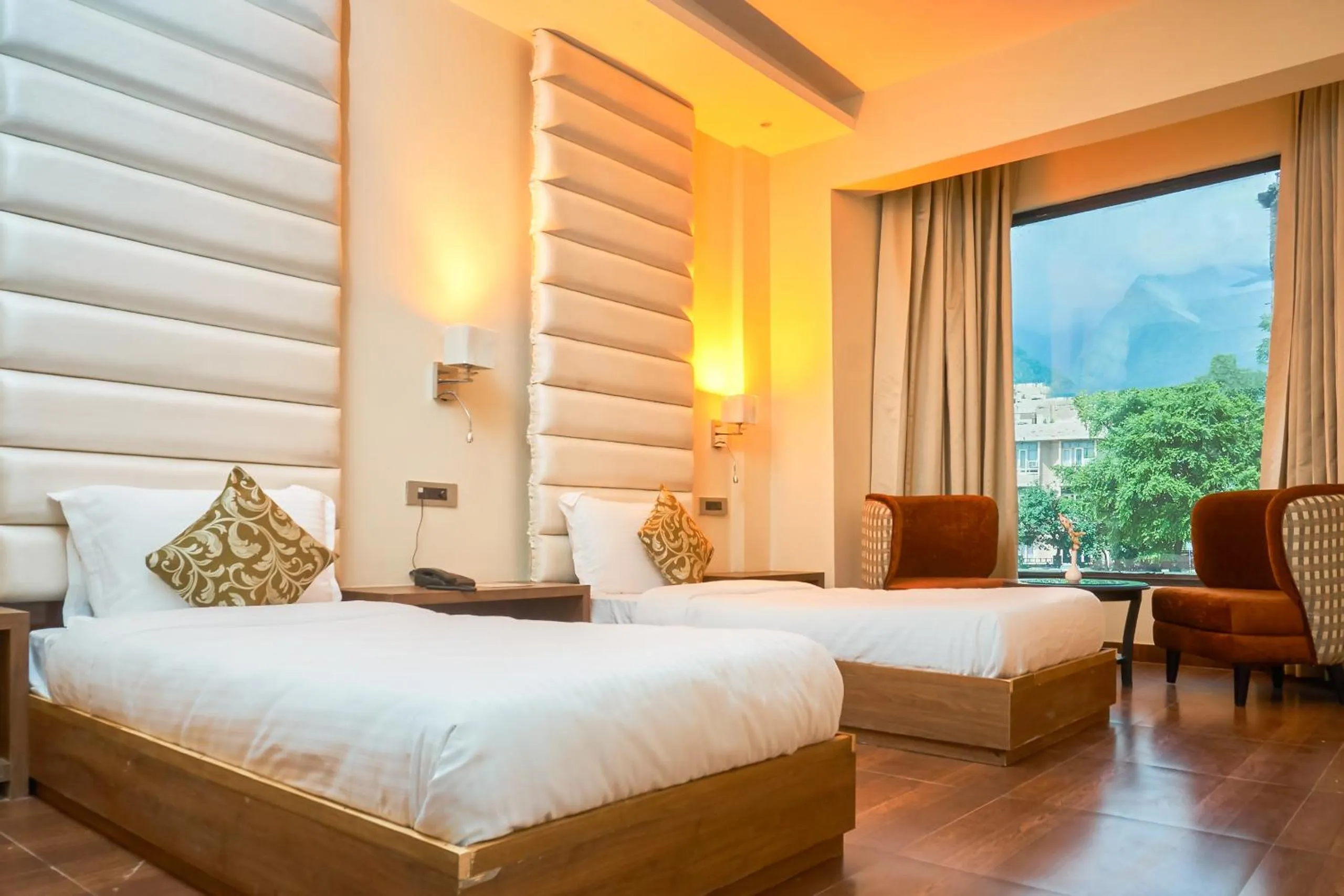 Photo of the whole room, Bed in Ganpati Hotel Katra