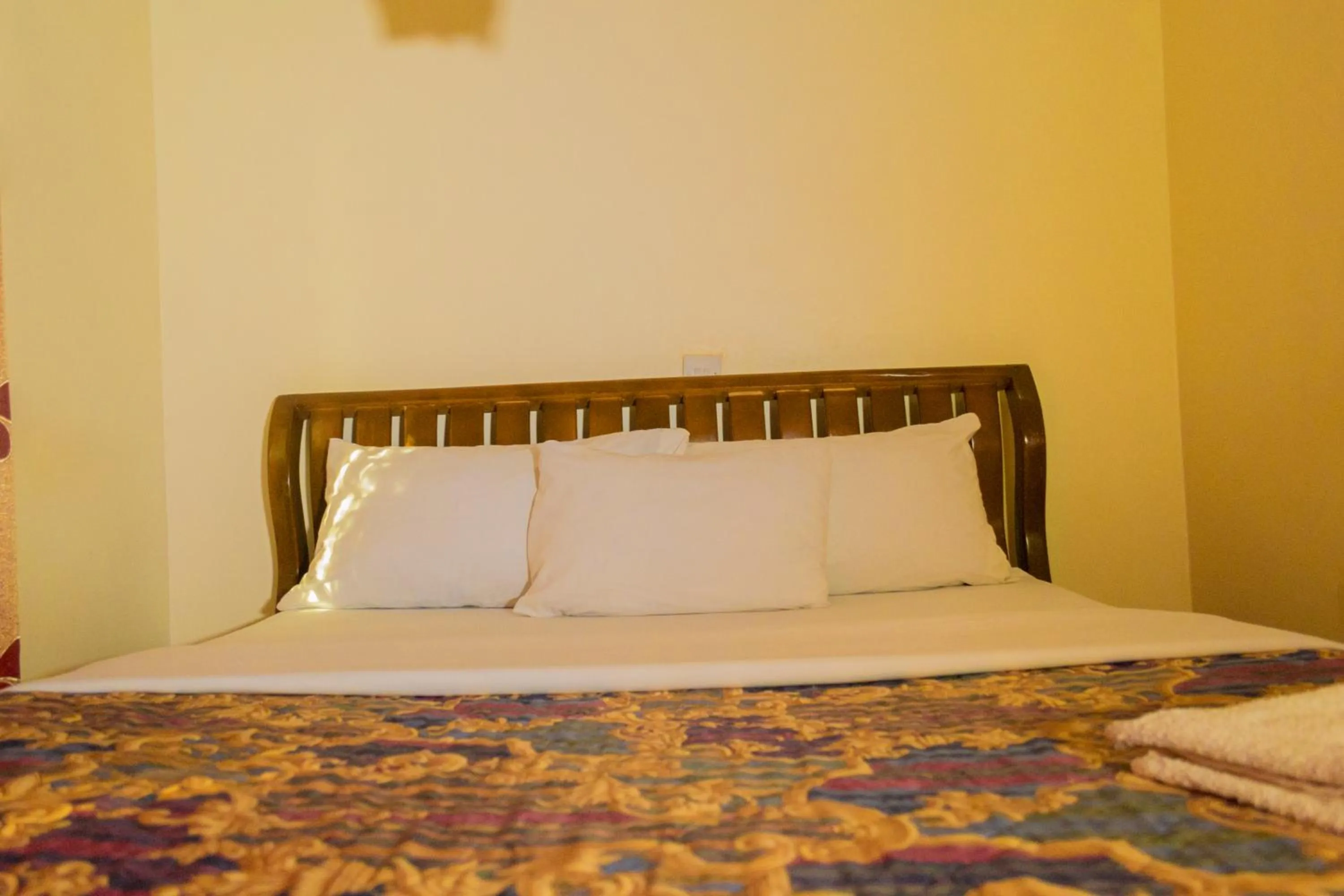 Bed in Sadrina Comfort Cottages Kyanja Kampala