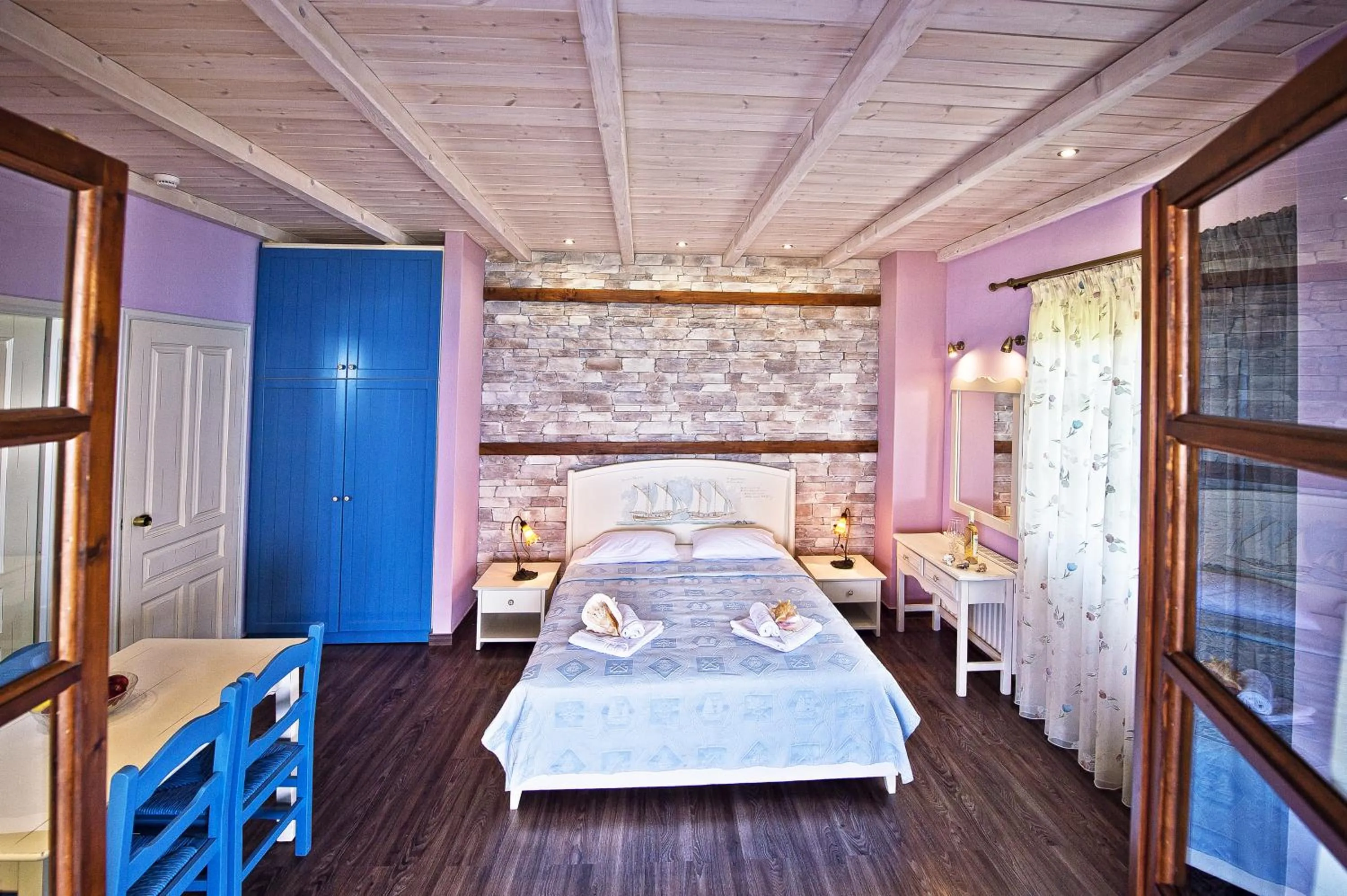 Photo of the whole room, Bed in Flamingo Hotel Pelion - Seaside Superior Studios & Suites