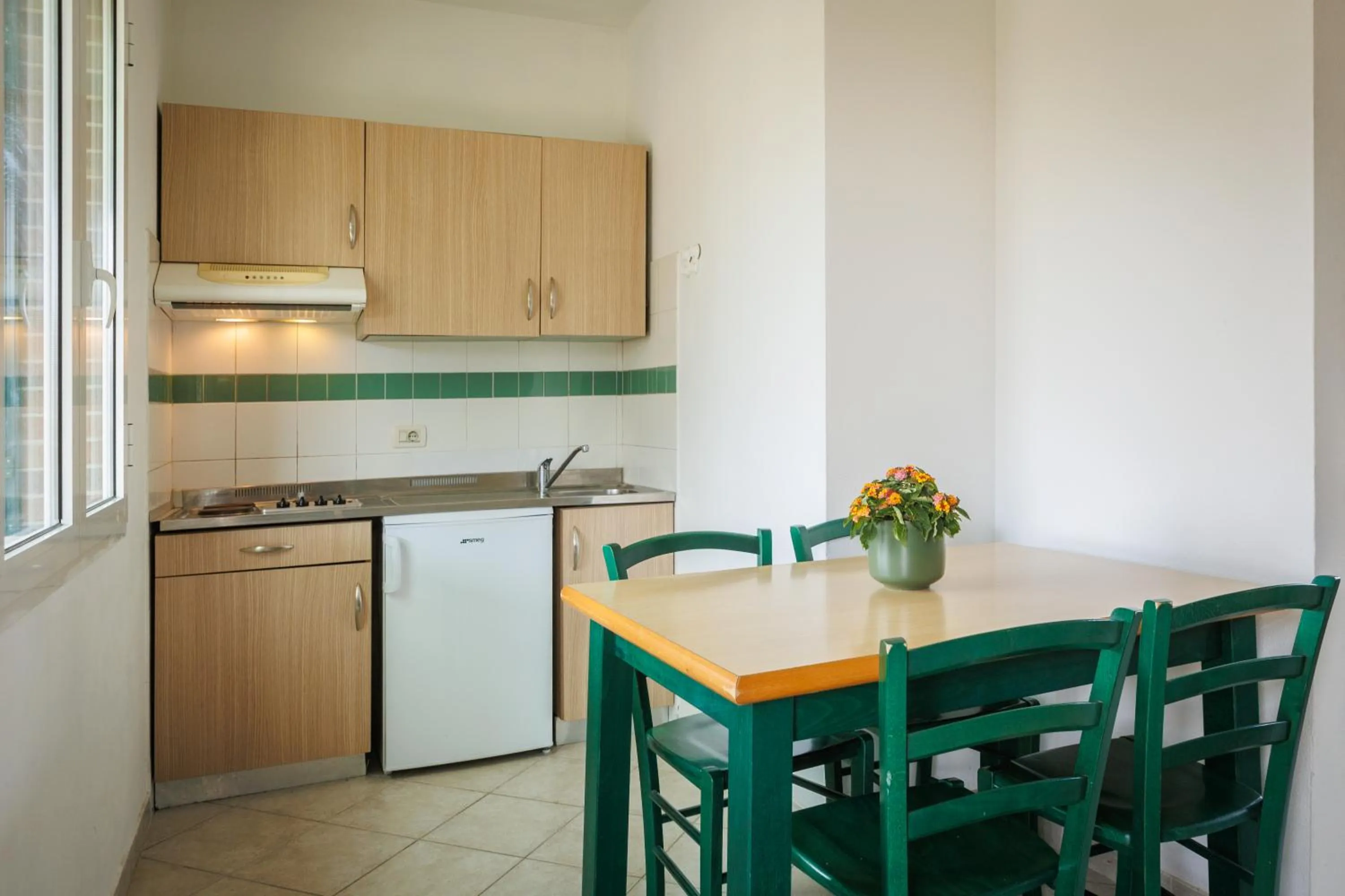 Kitchen or kitchenette in Villaggio Turistico La Cecinella