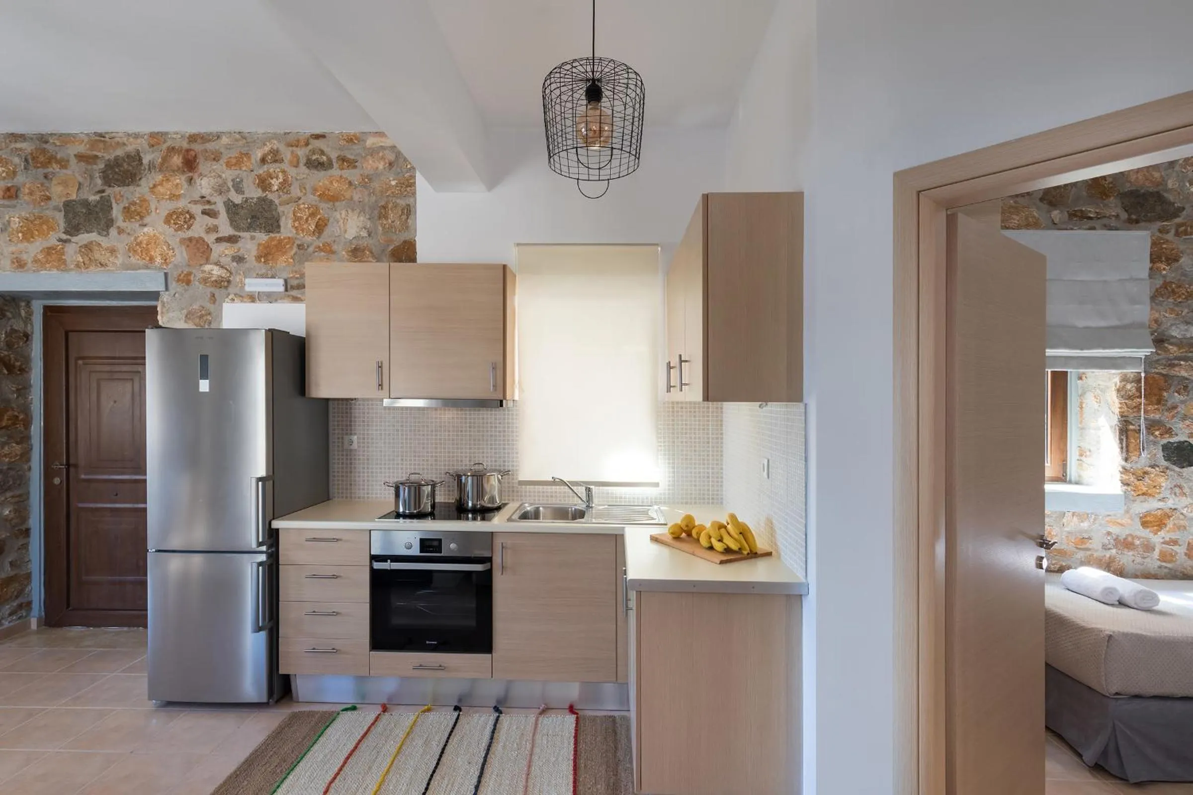 Kitchen or kitchenette in Syra Suites