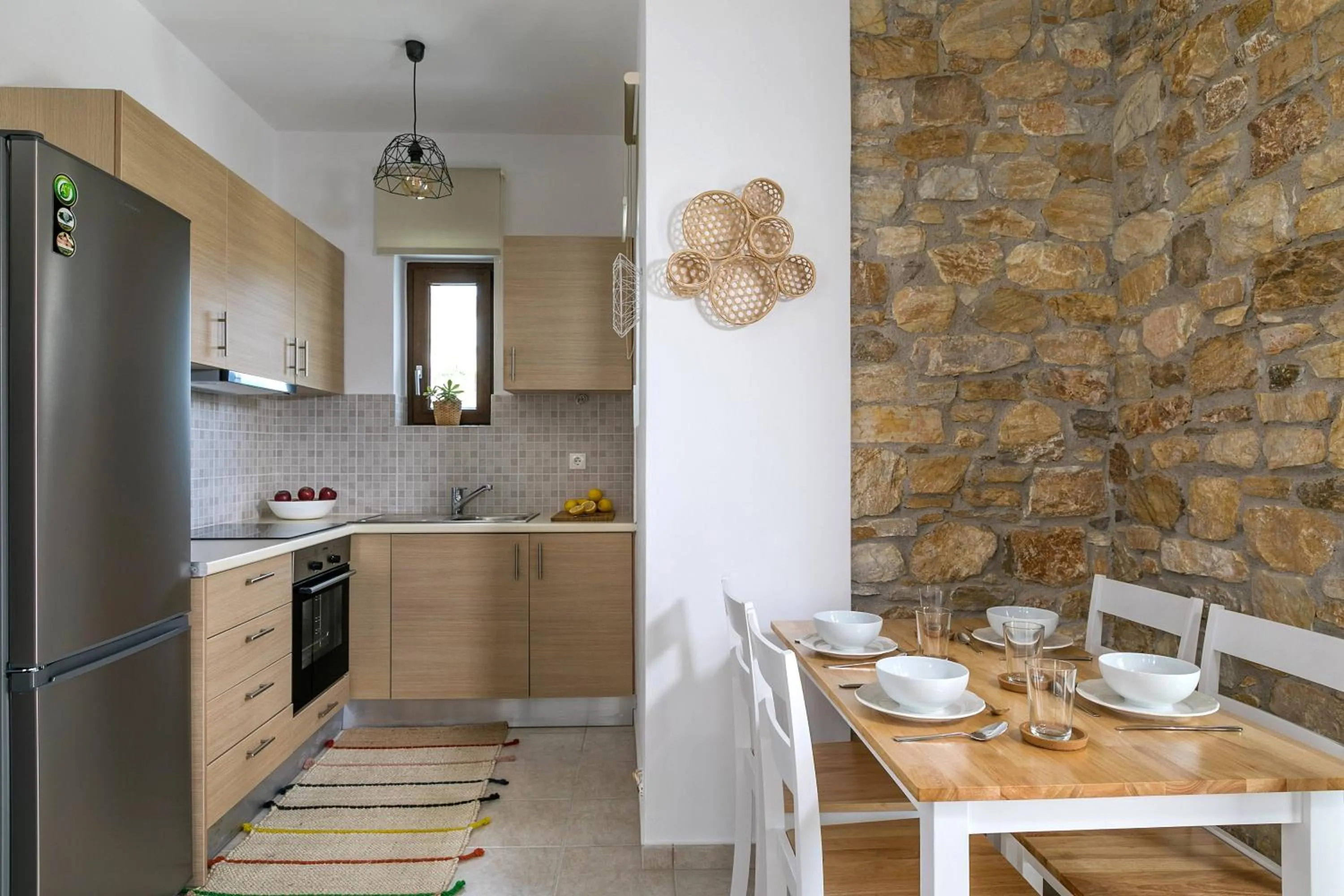 Kitchen or kitchenette in Syra Suites