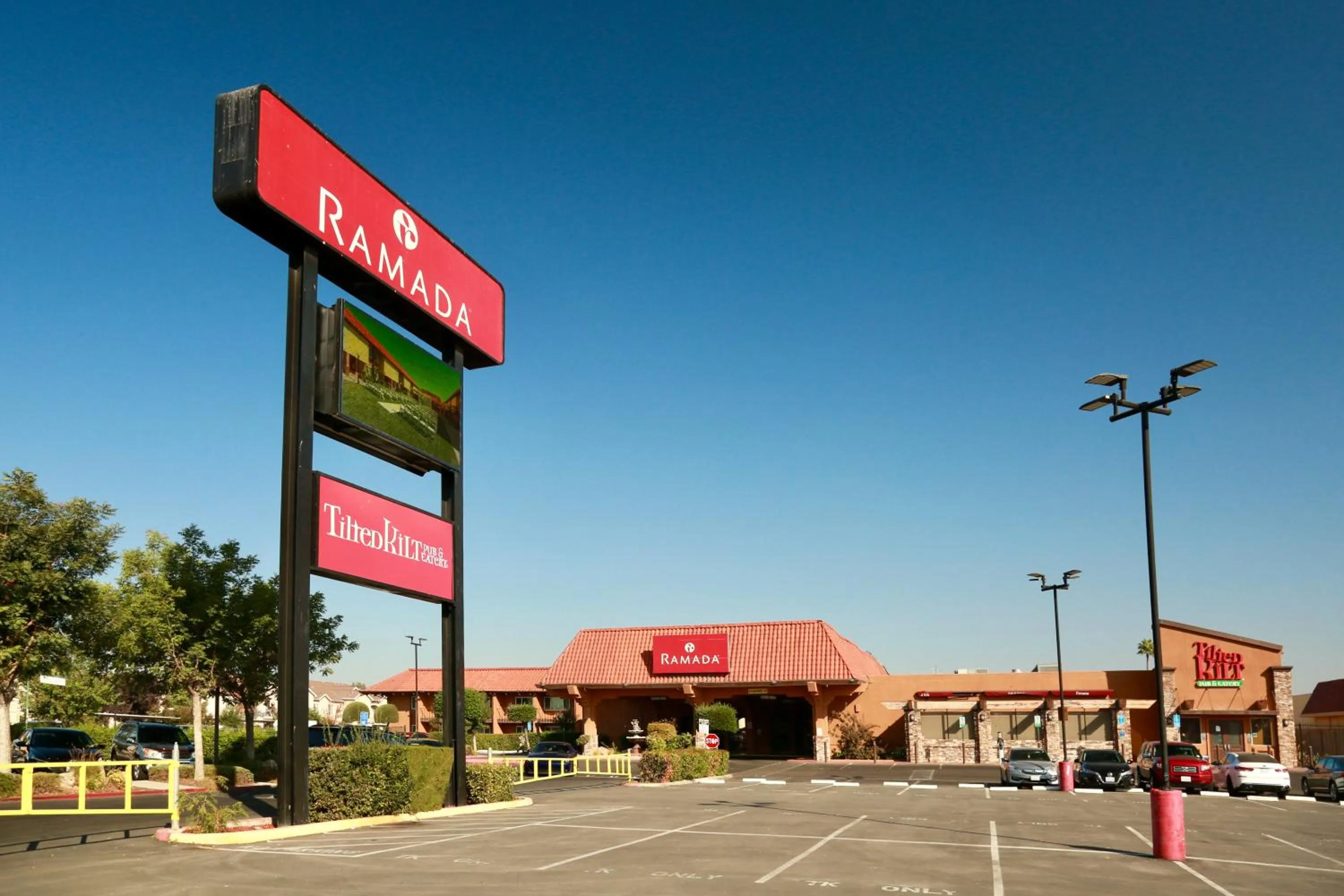 Property logo or sign in Ramada by Wyndham Fresno North