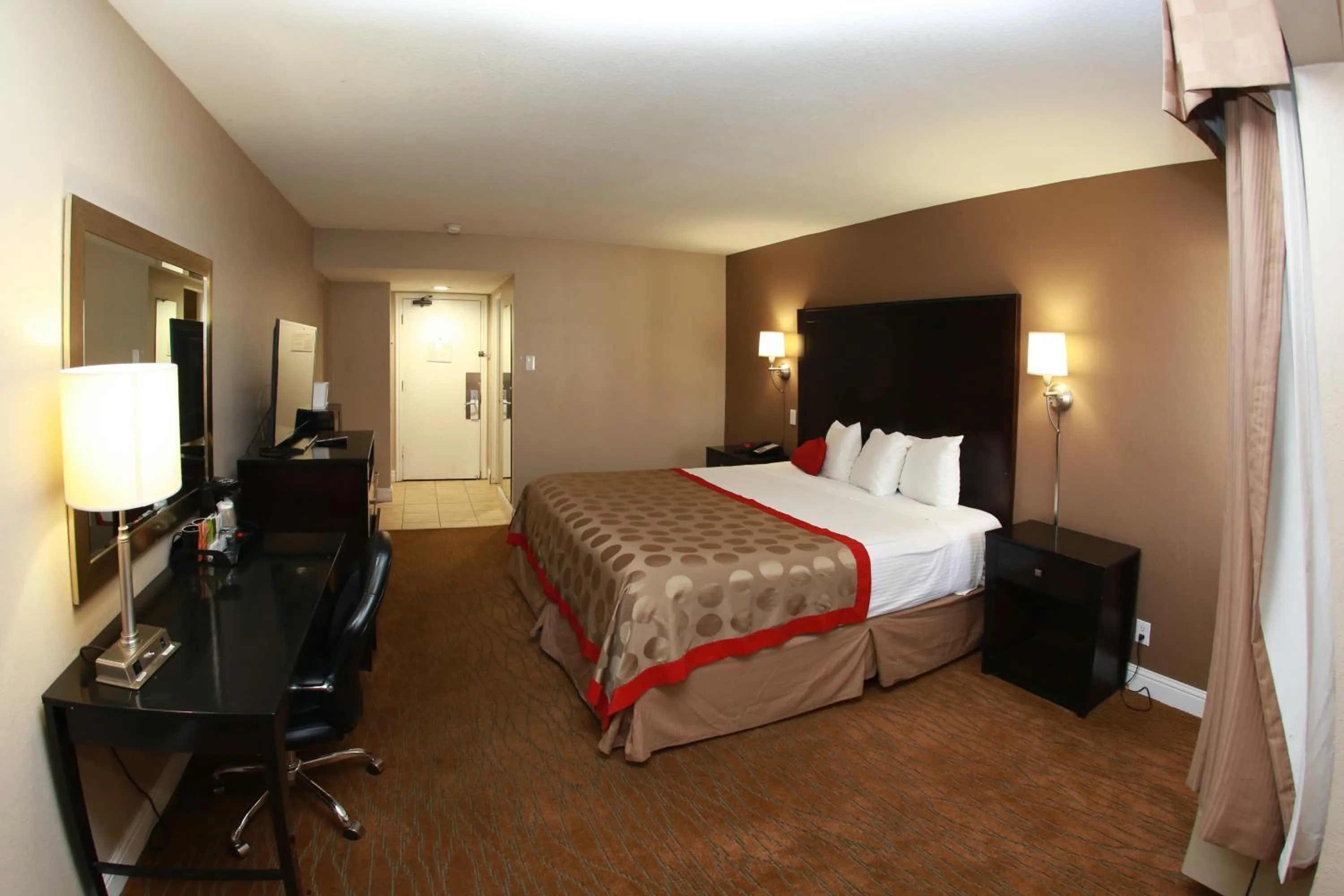 Bed in Ramada by Wyndham Fresno North