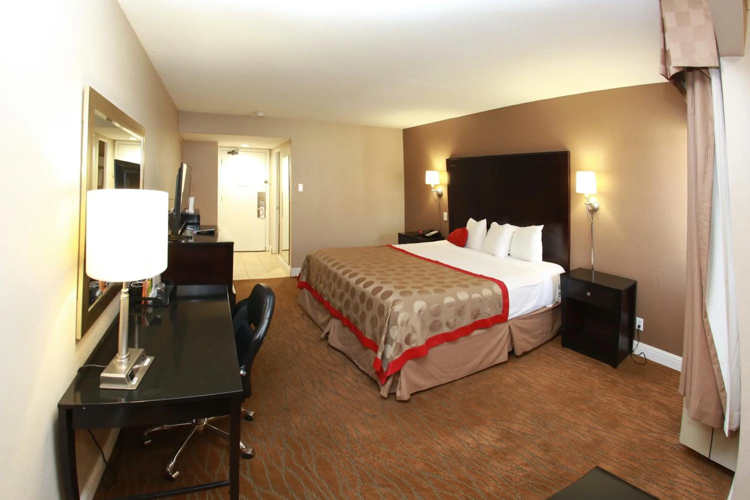Bed in Ramada by Wyndham Fresno North