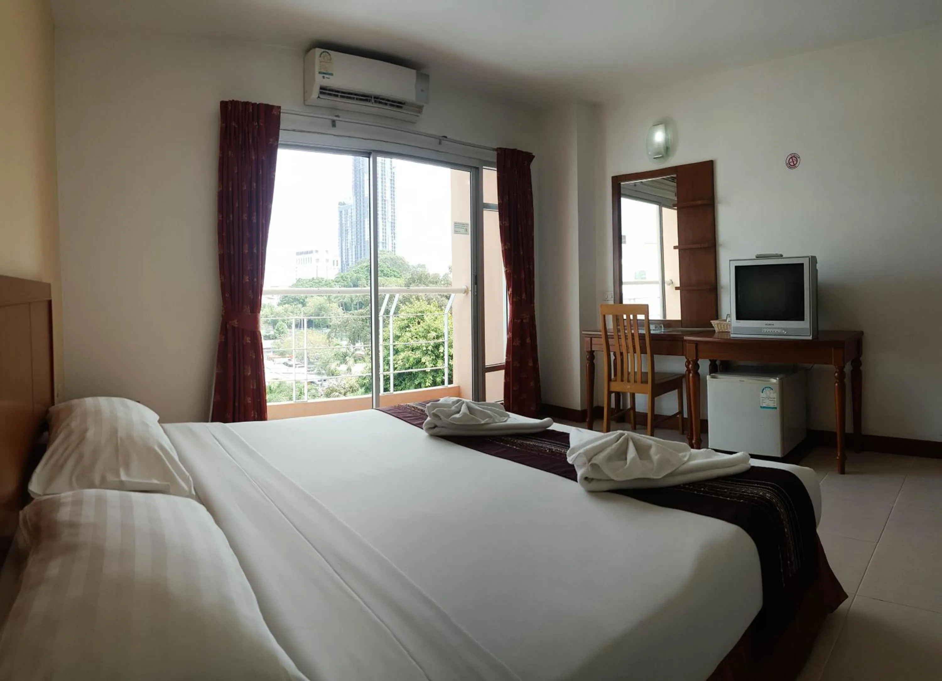 Bed in Eastiny Seven Hotel