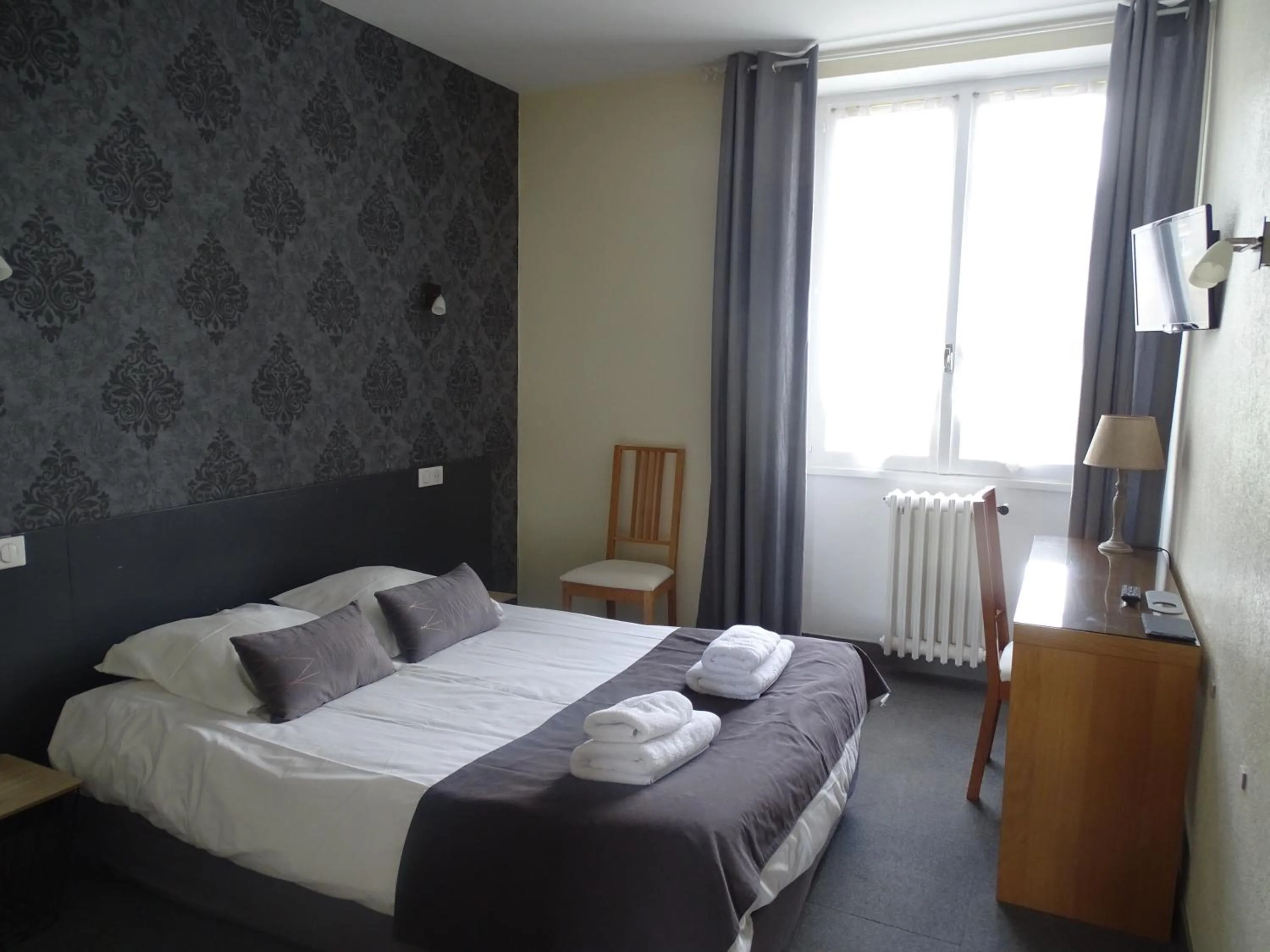 Photo of the whole room, Bed in Logis Hôtel AMBROISE