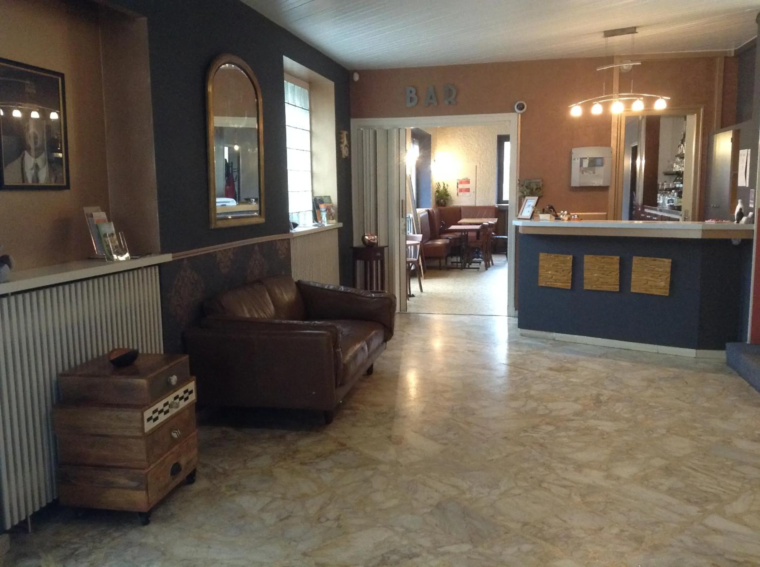 Lobby or reception in Logis Hôtel AMBROISE