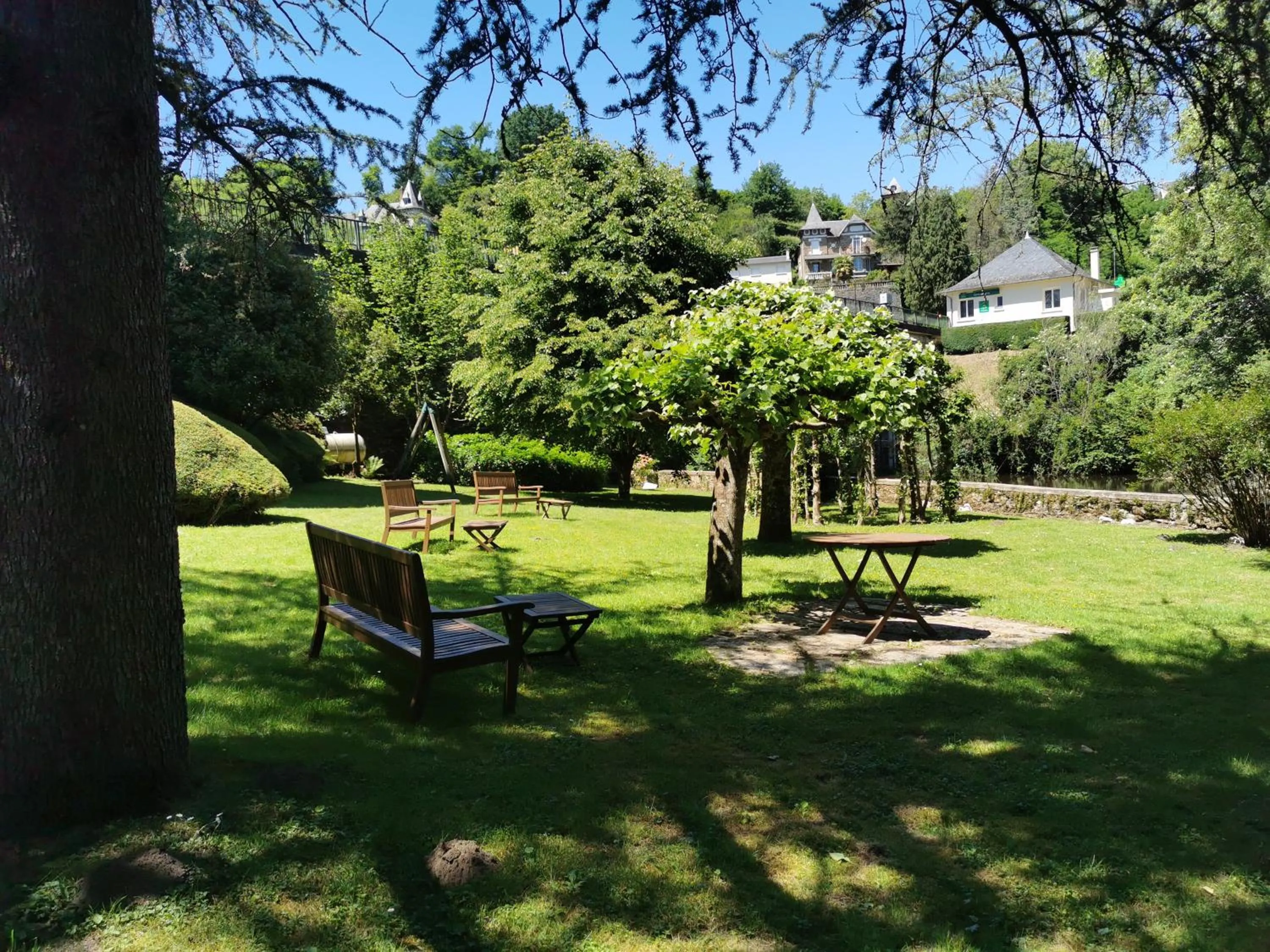 Garden view in Logis Hôtel AMBROISE
