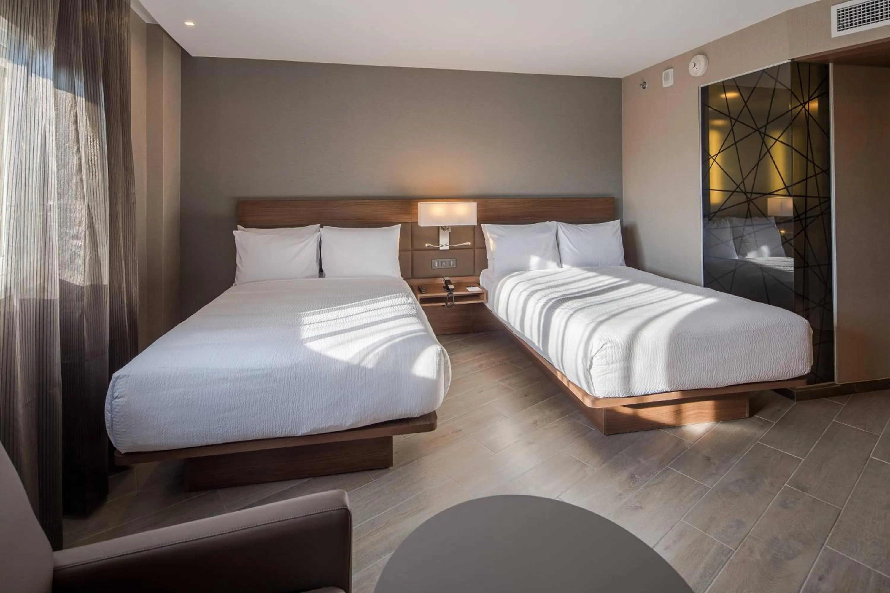 Photo of the whole room, Bed in AC Hotel by Marriott Guadalajara Expo