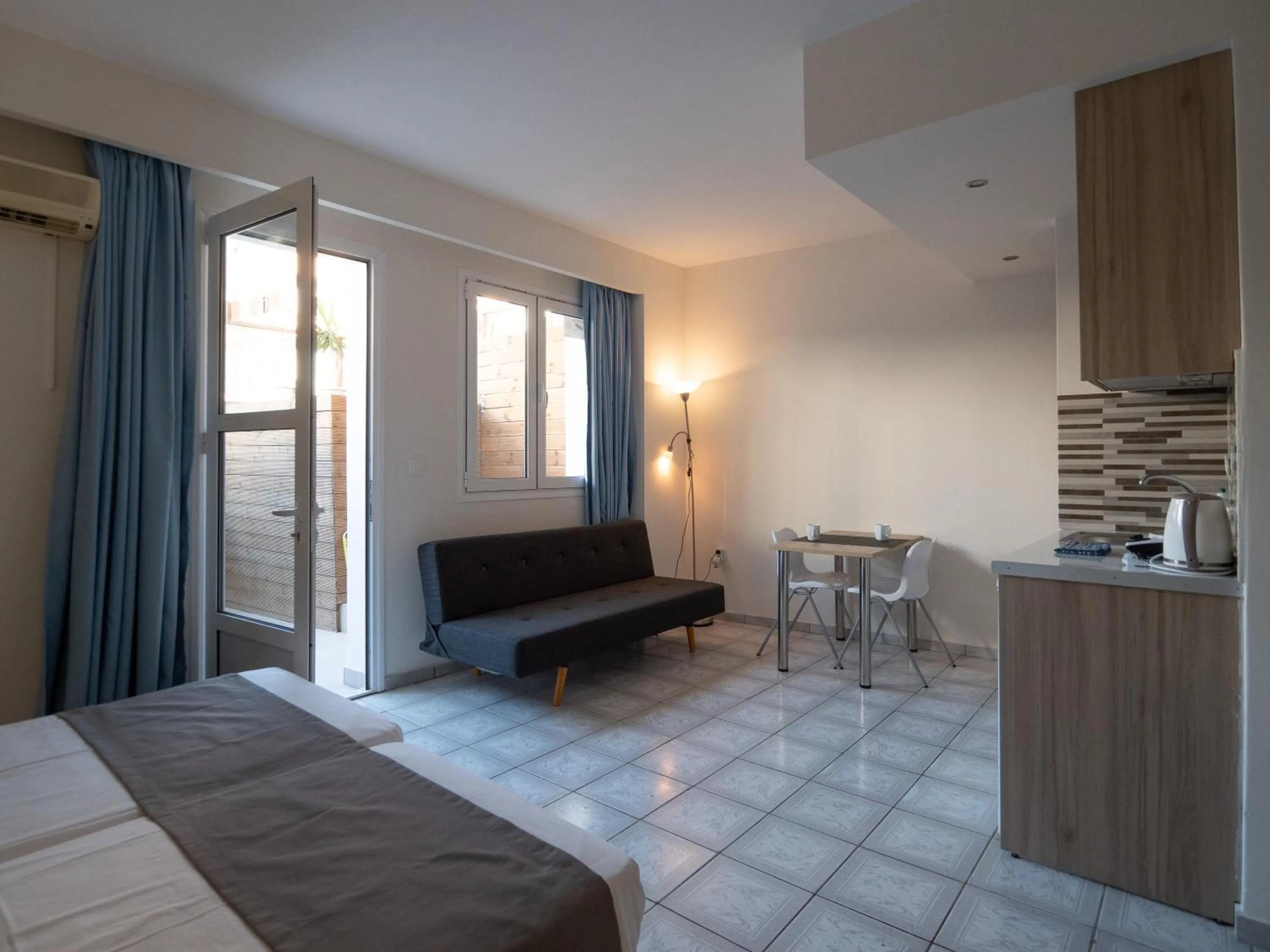 Living room, Bed in Aristo Apts