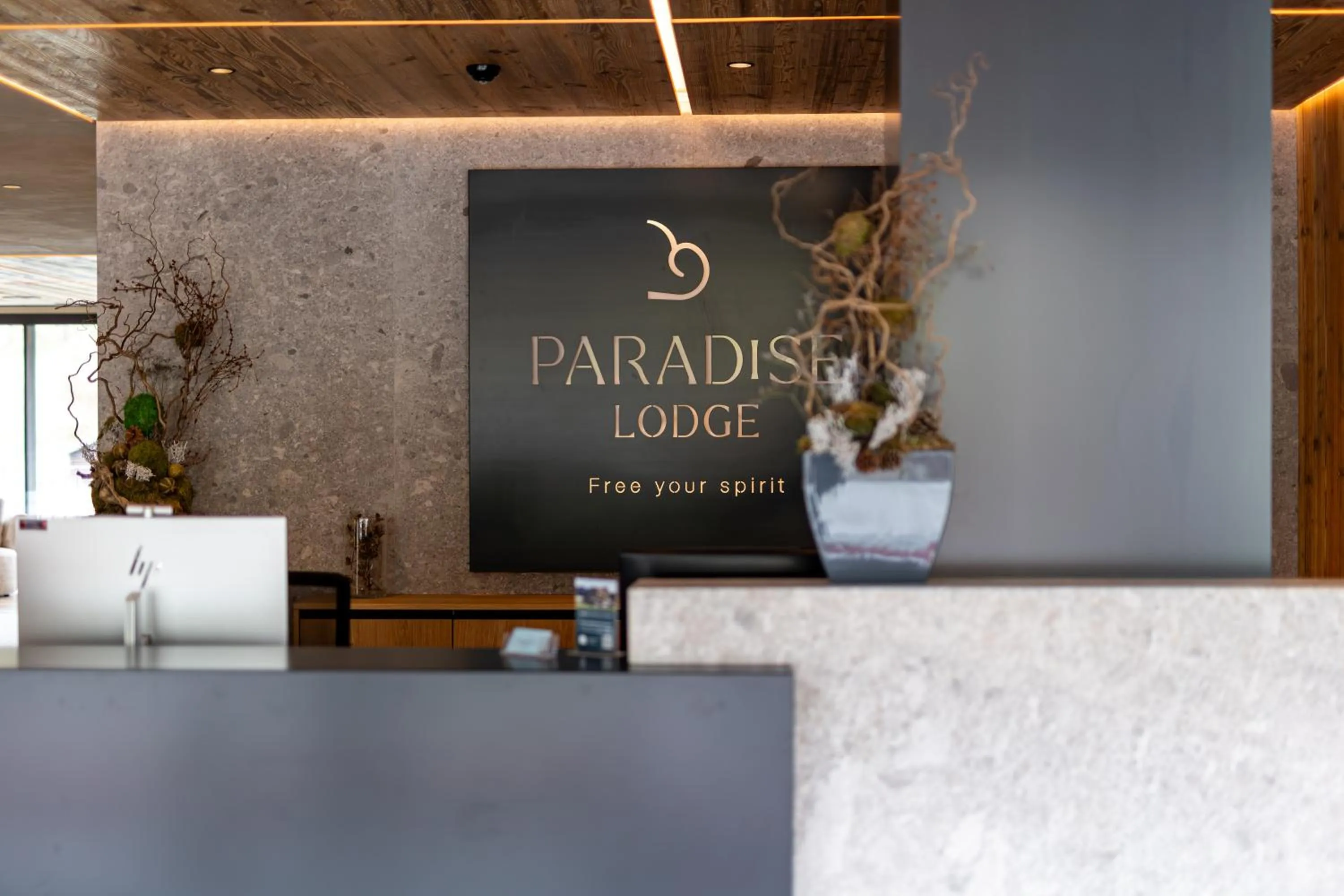 Property logo or sign in Paradise Lodge