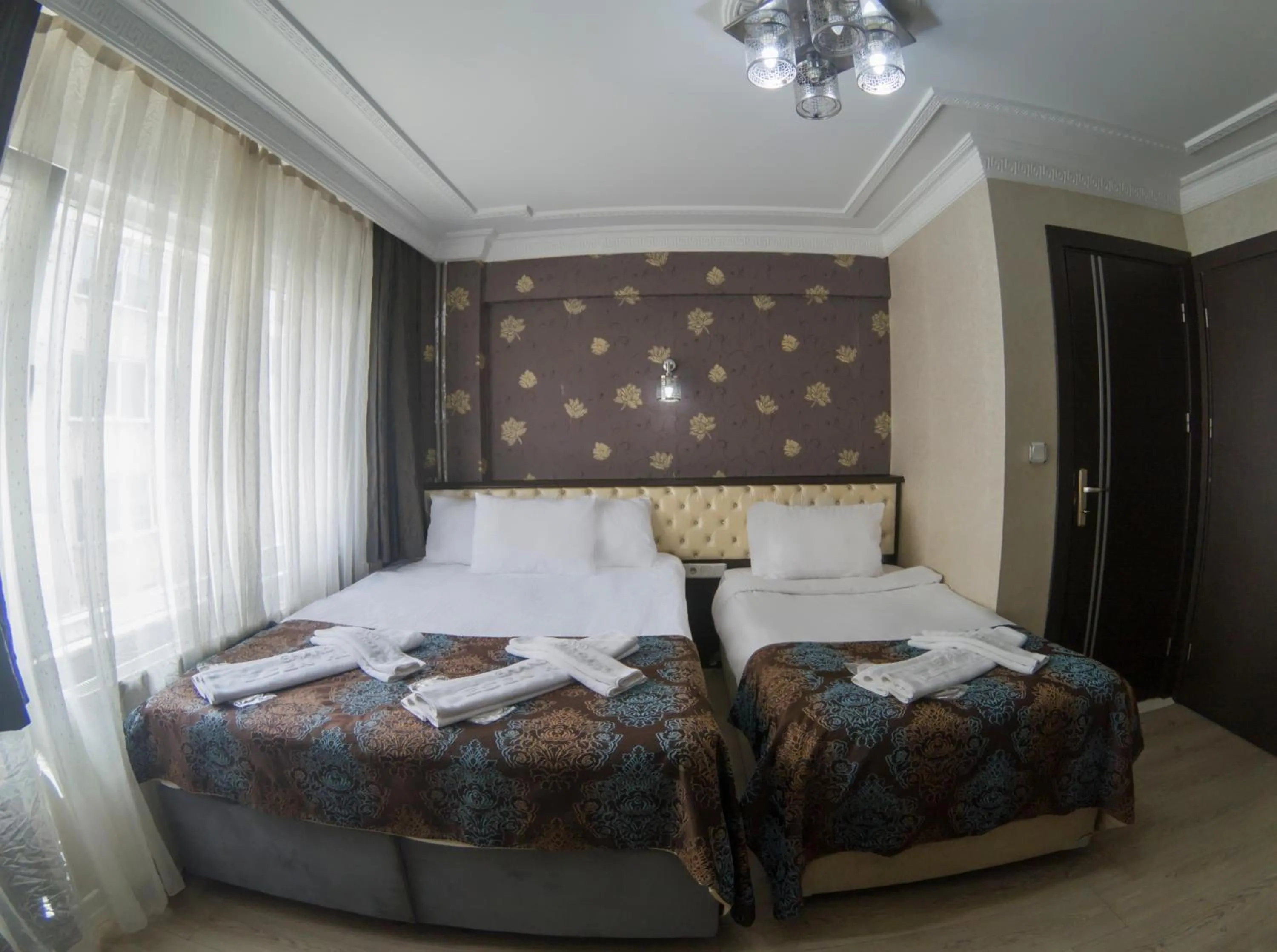 Bed in Grand Esen Hotel