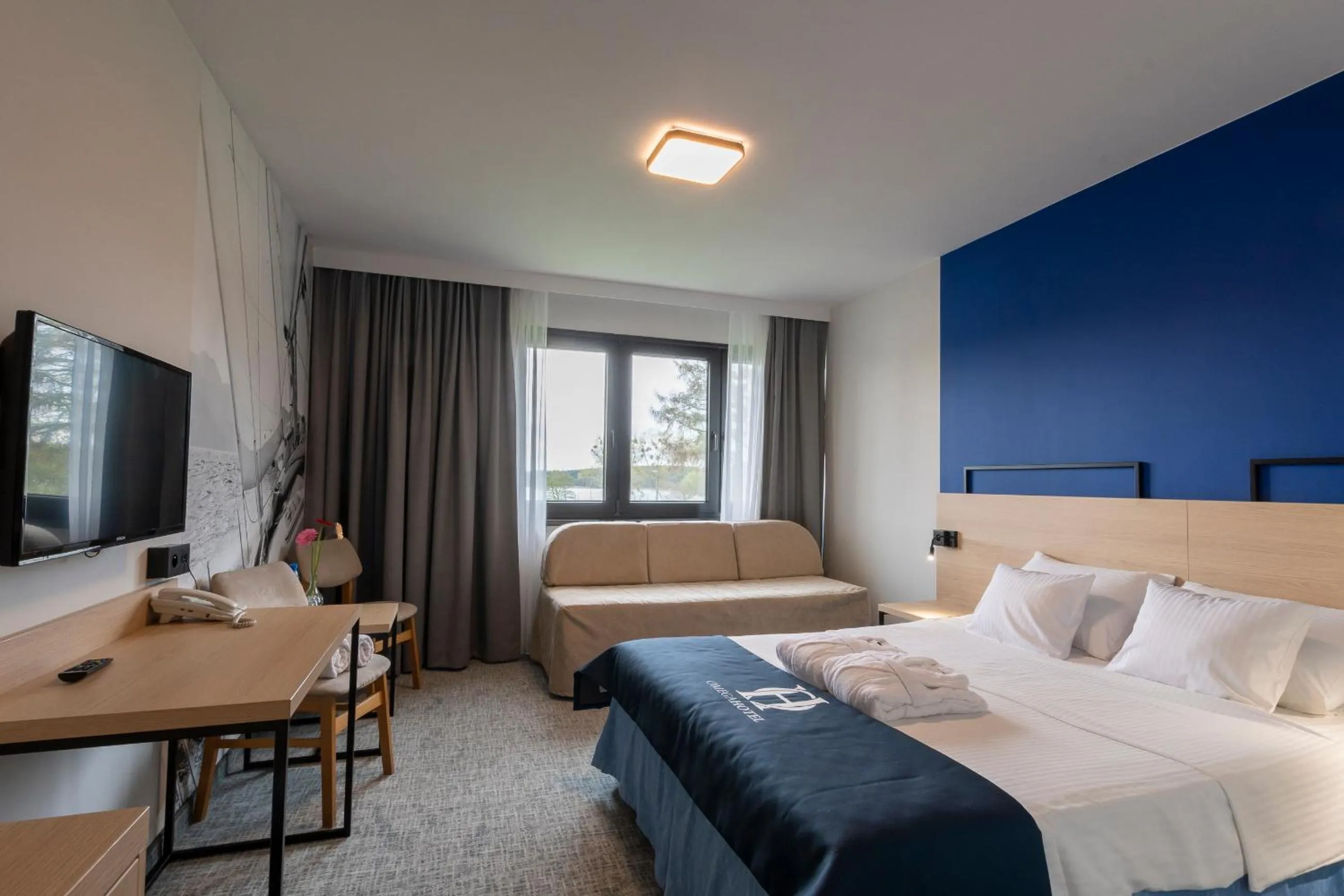 Photo of the whole room, Bed in Omega Hotel