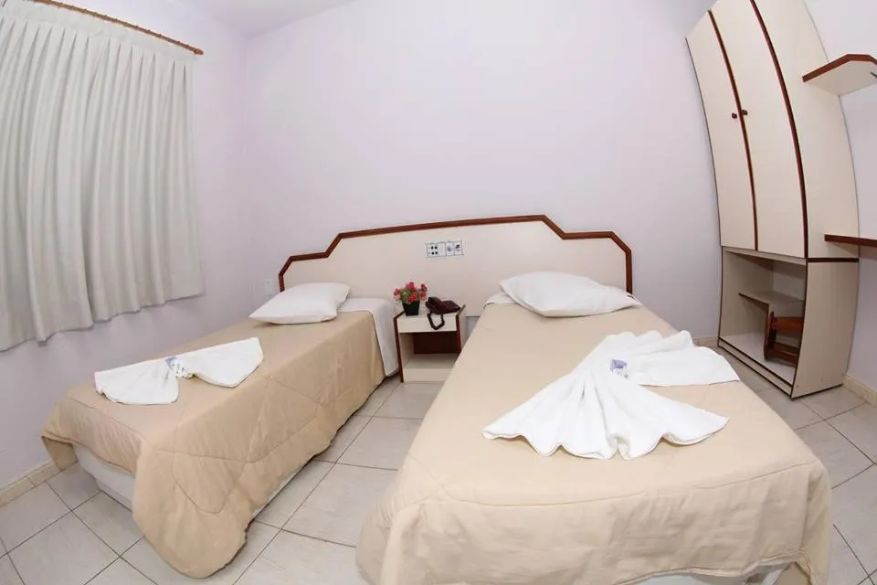 Bed in Hotel Tubarao