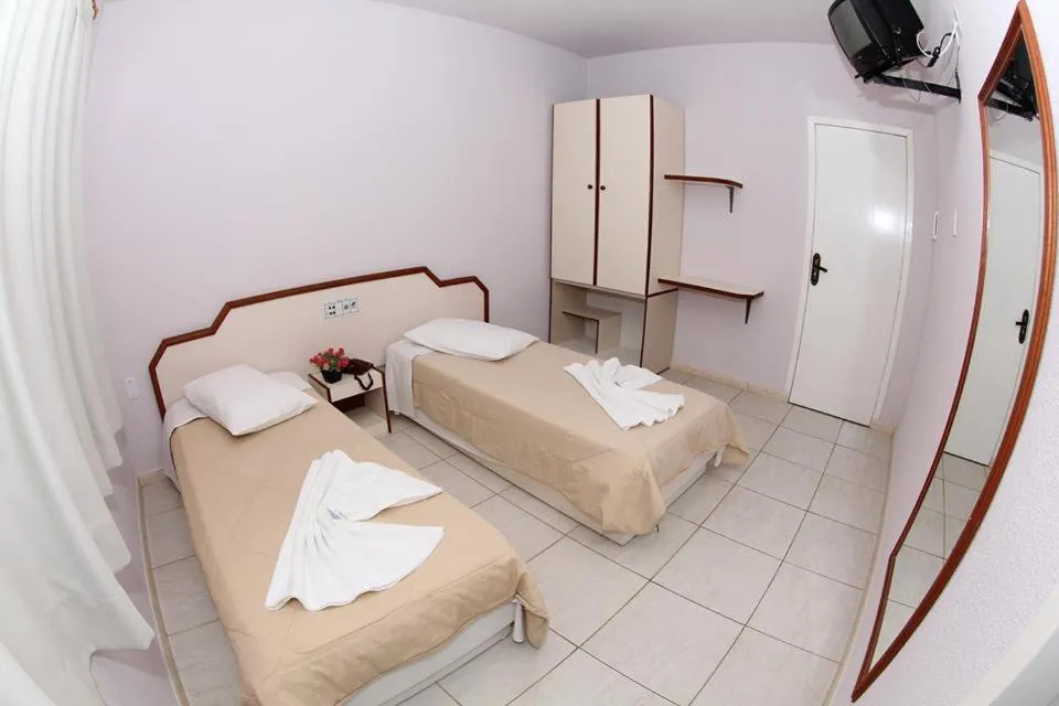 Bed in Hotel Tubarao