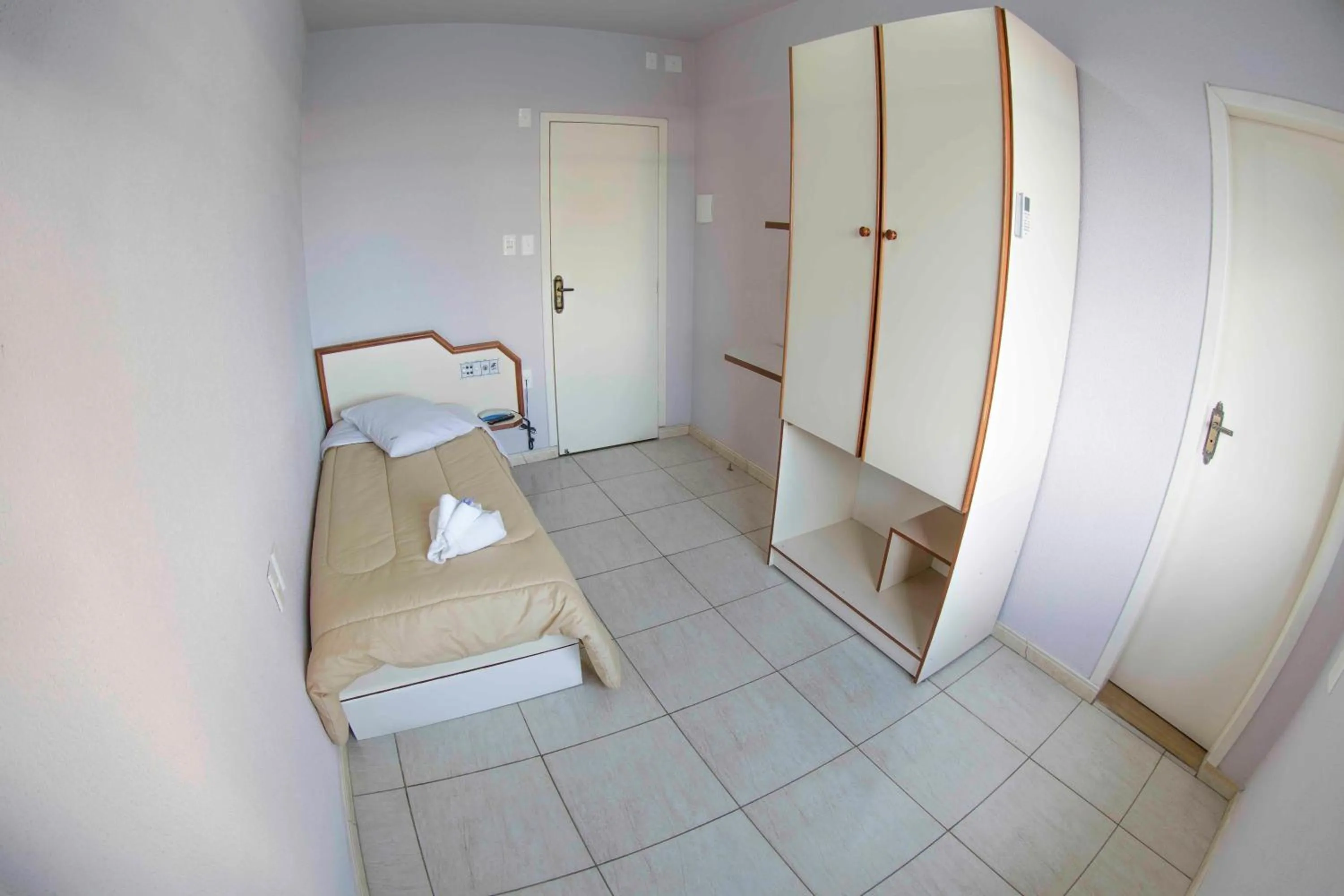 Bed in Hotel Tubarao