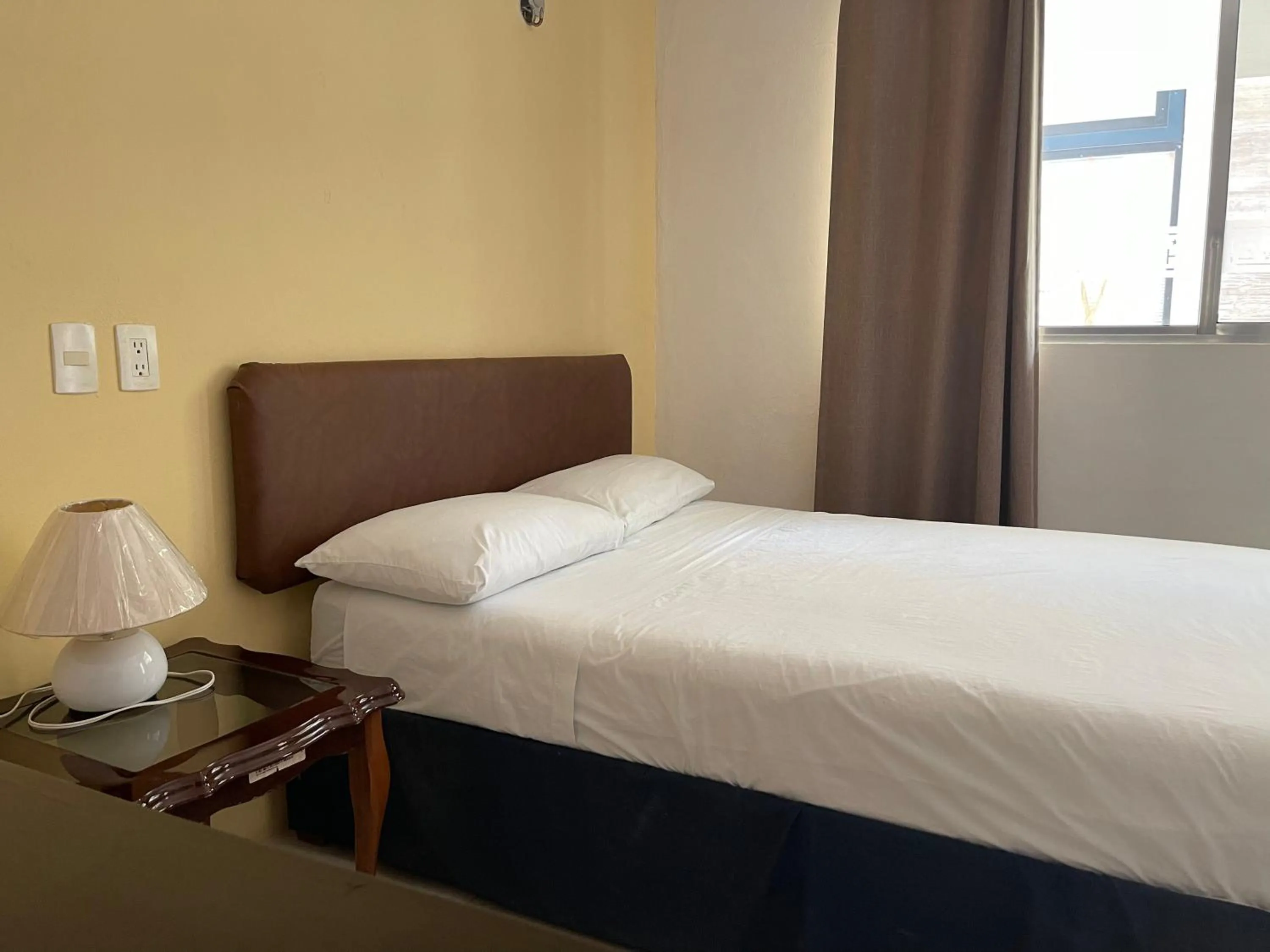 Bed in Hotel Villa Escondida Campeche