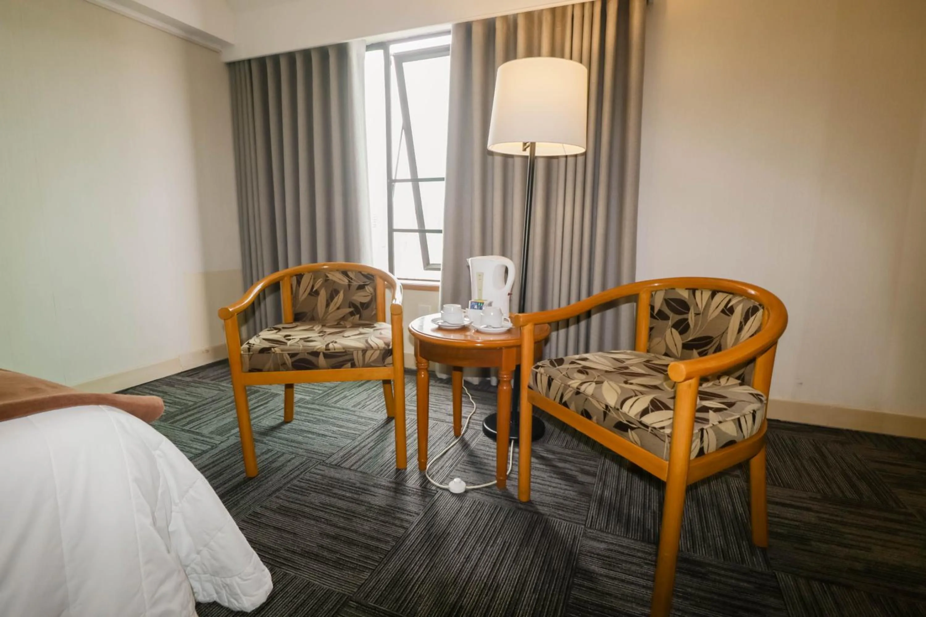 Living room, Bed in Hotel Miramar