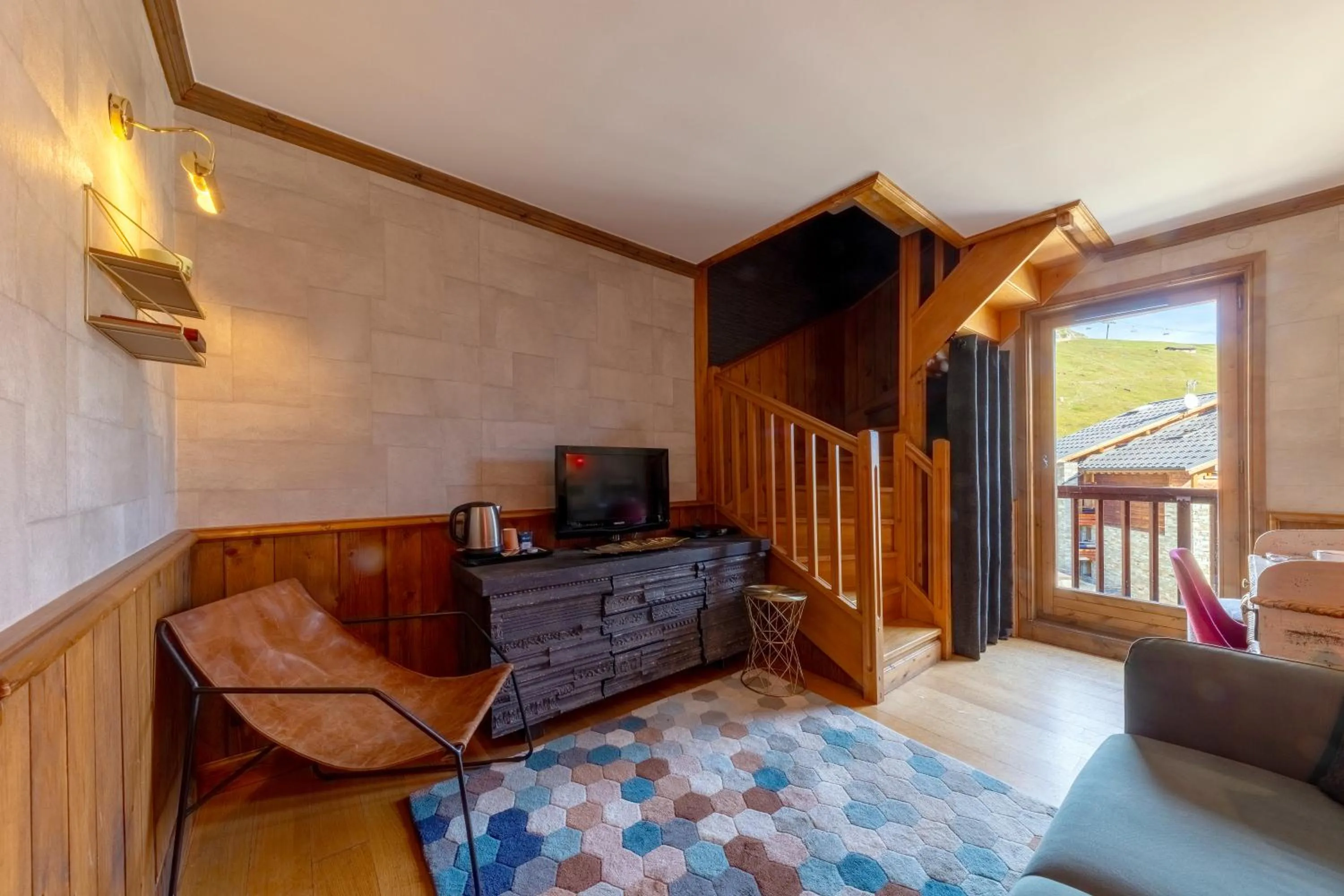 Seating area in Hôtel Village Montana by Les Etincelles