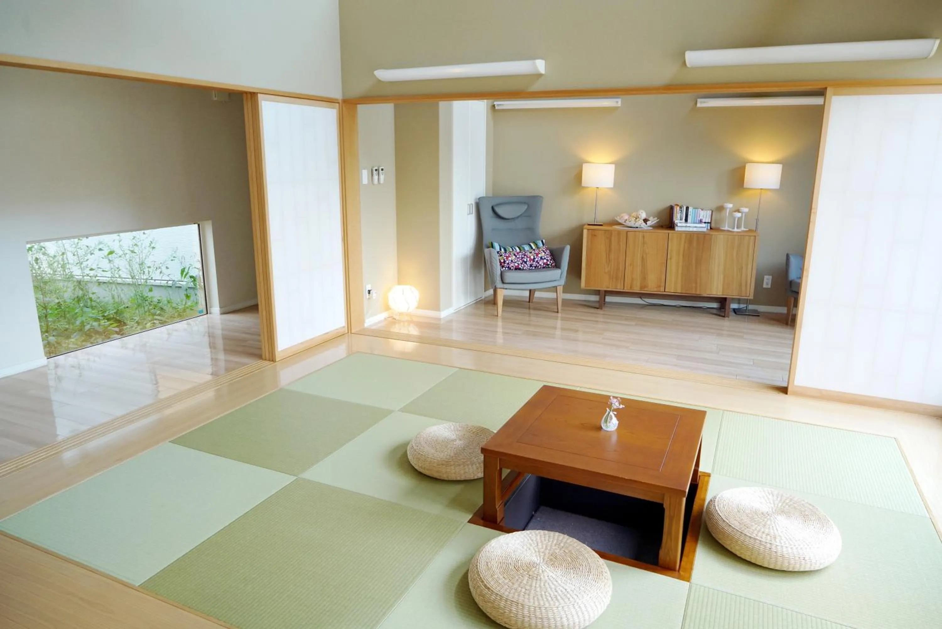 Living room, Bed in Villa Sapporo Honobono