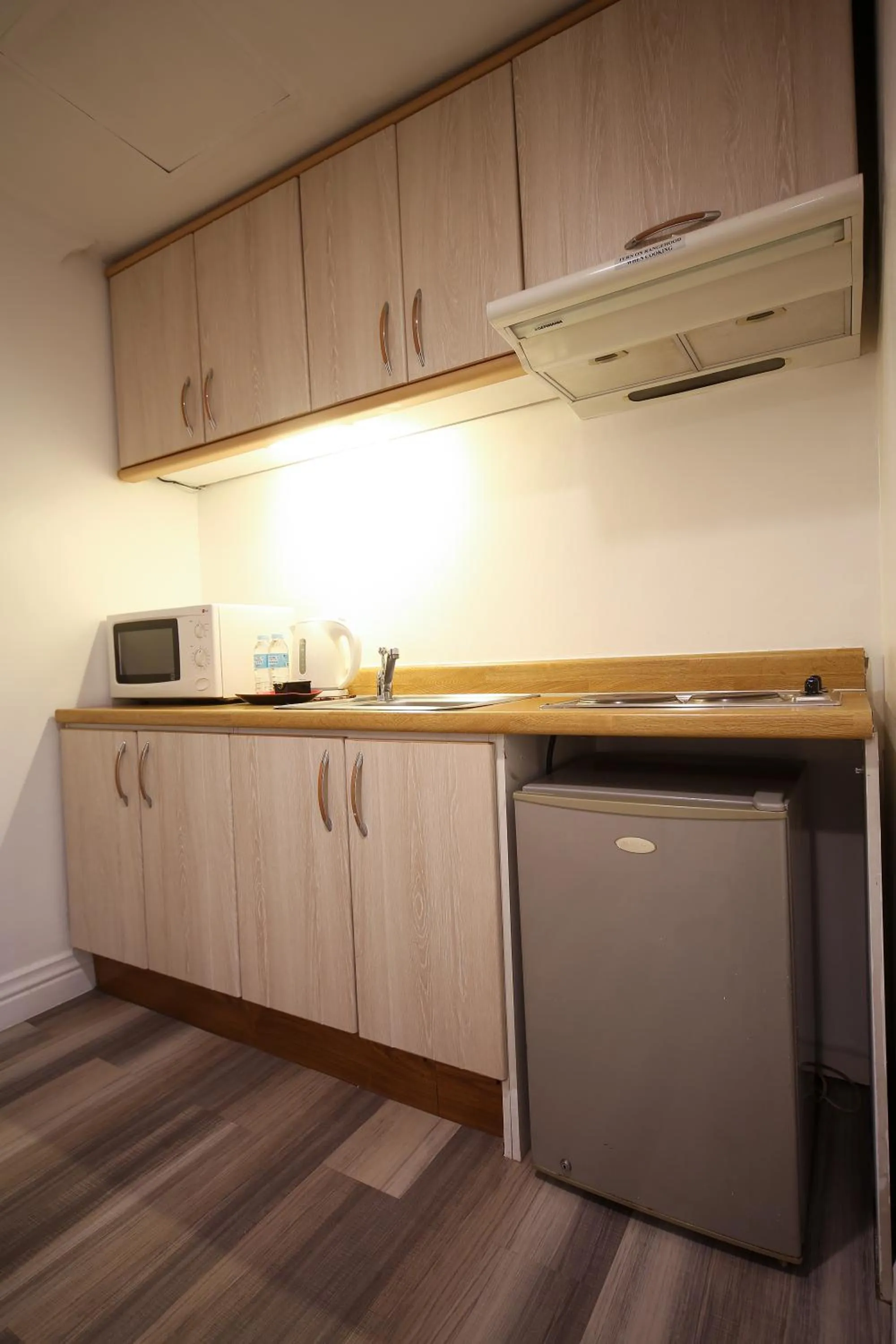 Kitchen or kitchenette in Infinity Tower Suites