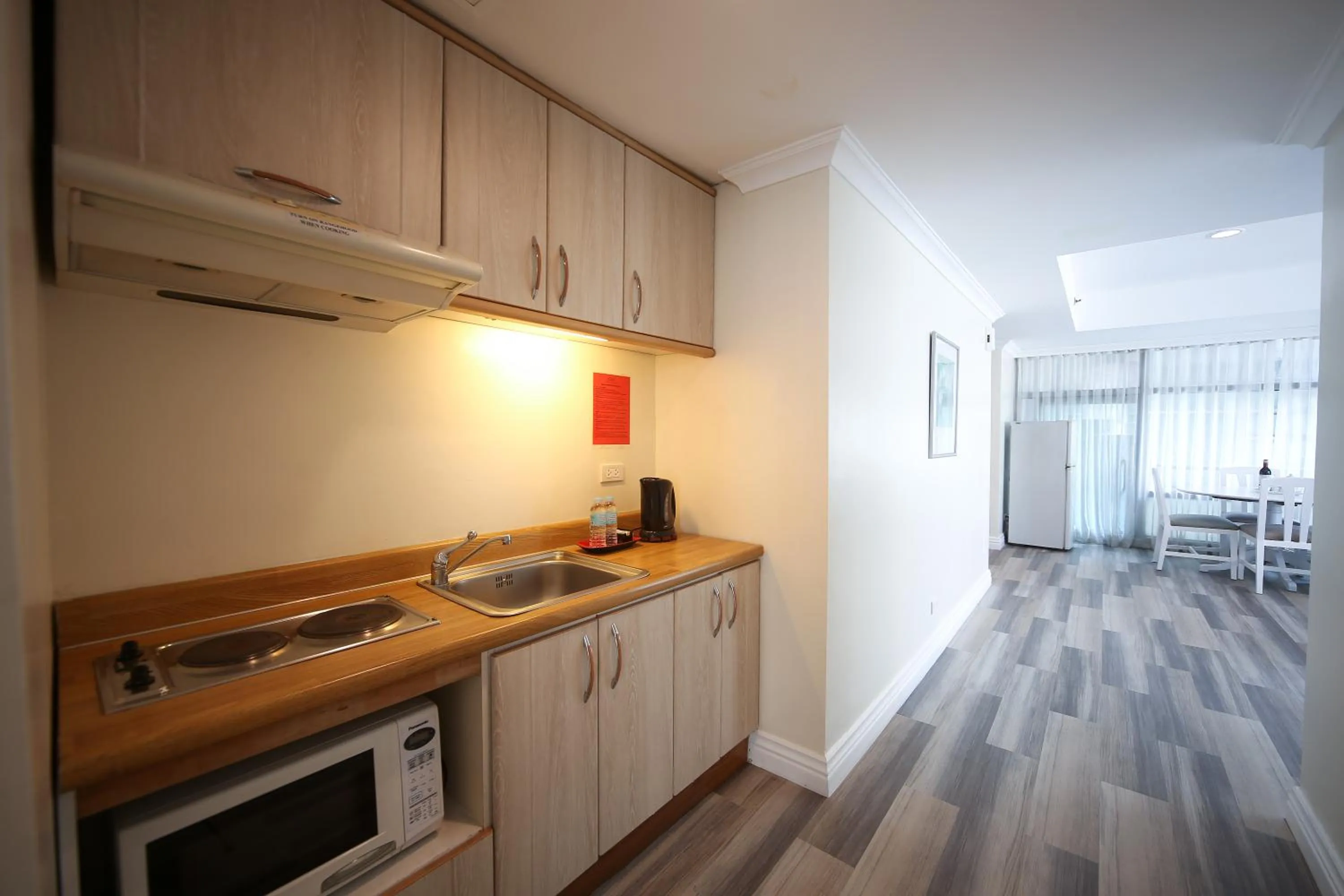 Kitchen or kitchenette in Infinity Tower Suites