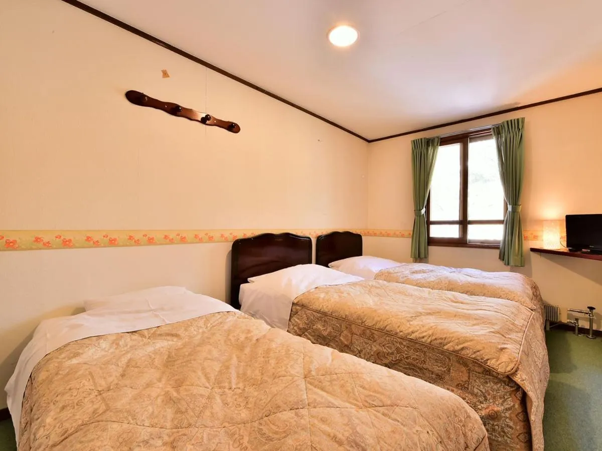 Bed in Kurumayama Kogen Guesthouse Urara