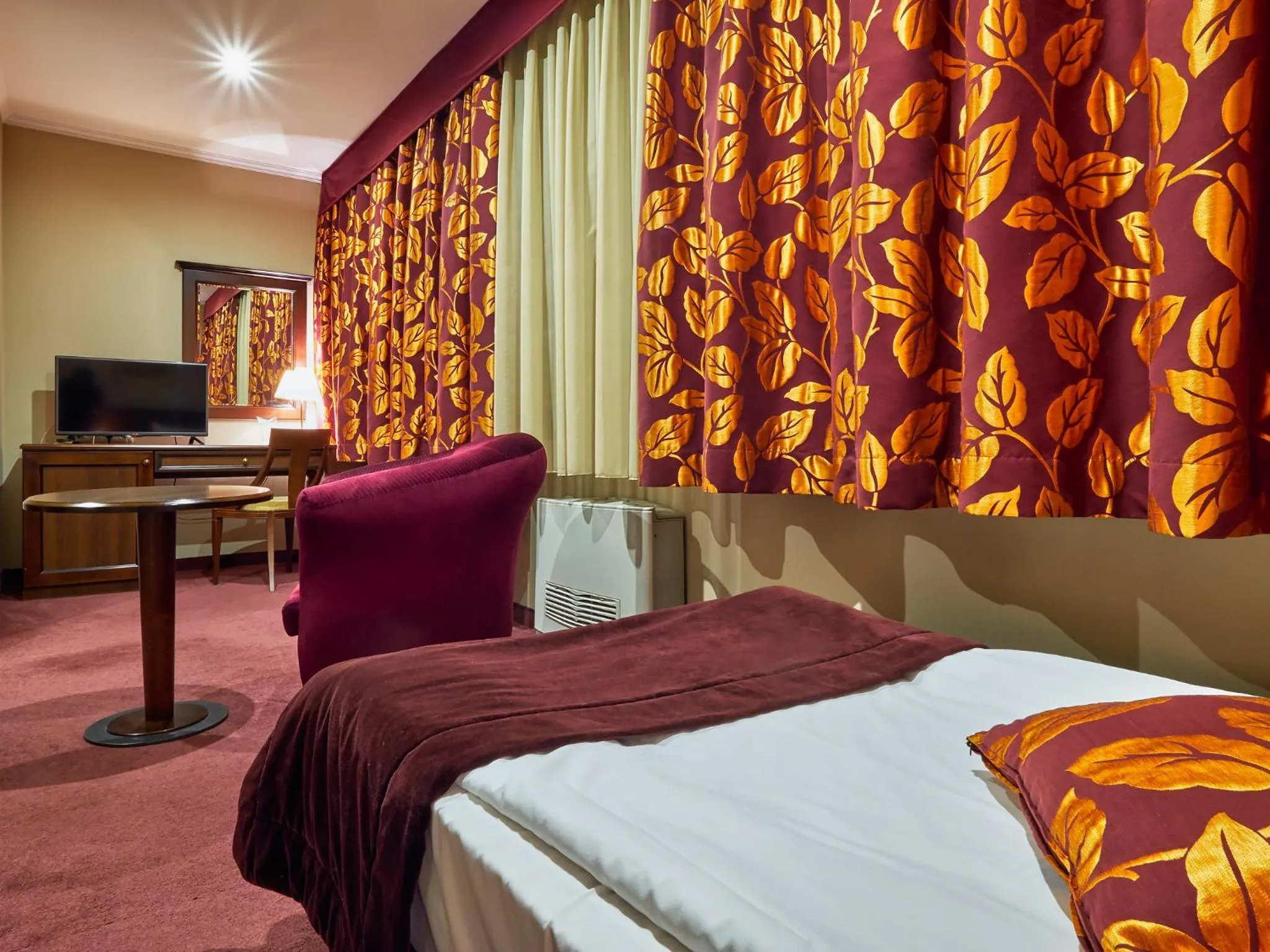 Bed in Yantra Grand Hotel