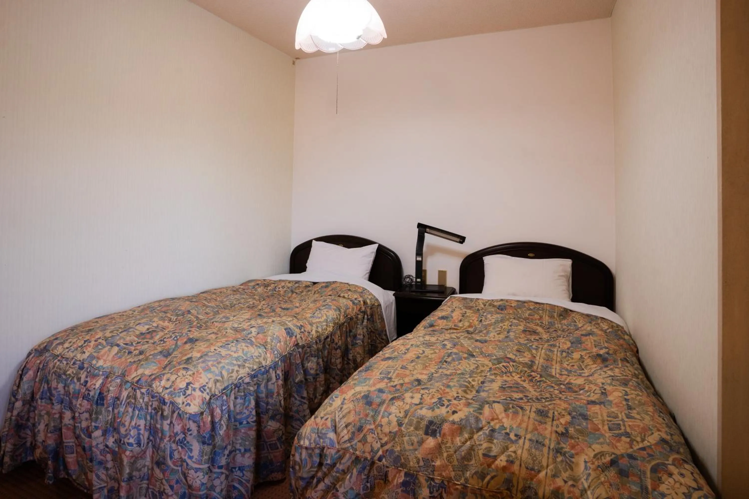 Bed in Hotel Yakushima Sanso