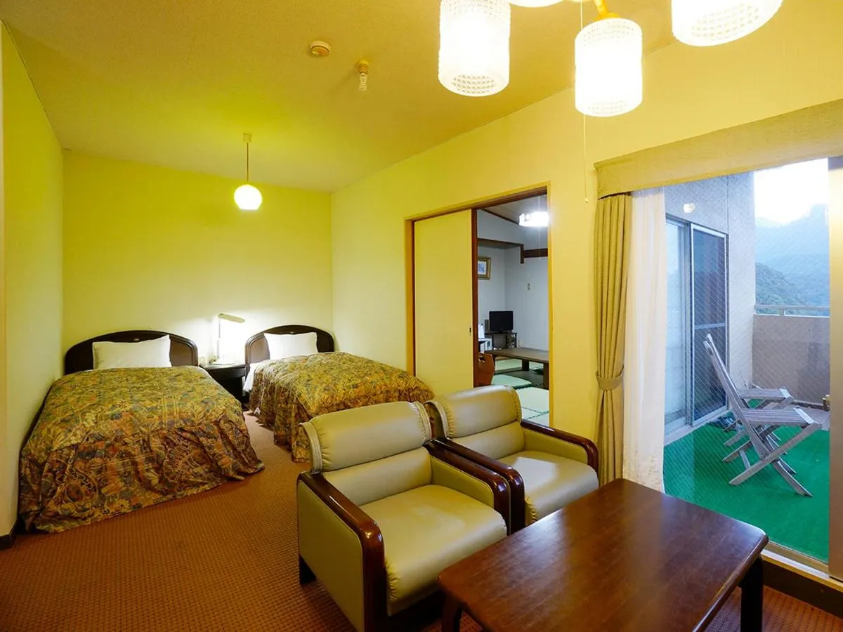 Bed in Hotel Yakushima Sanso