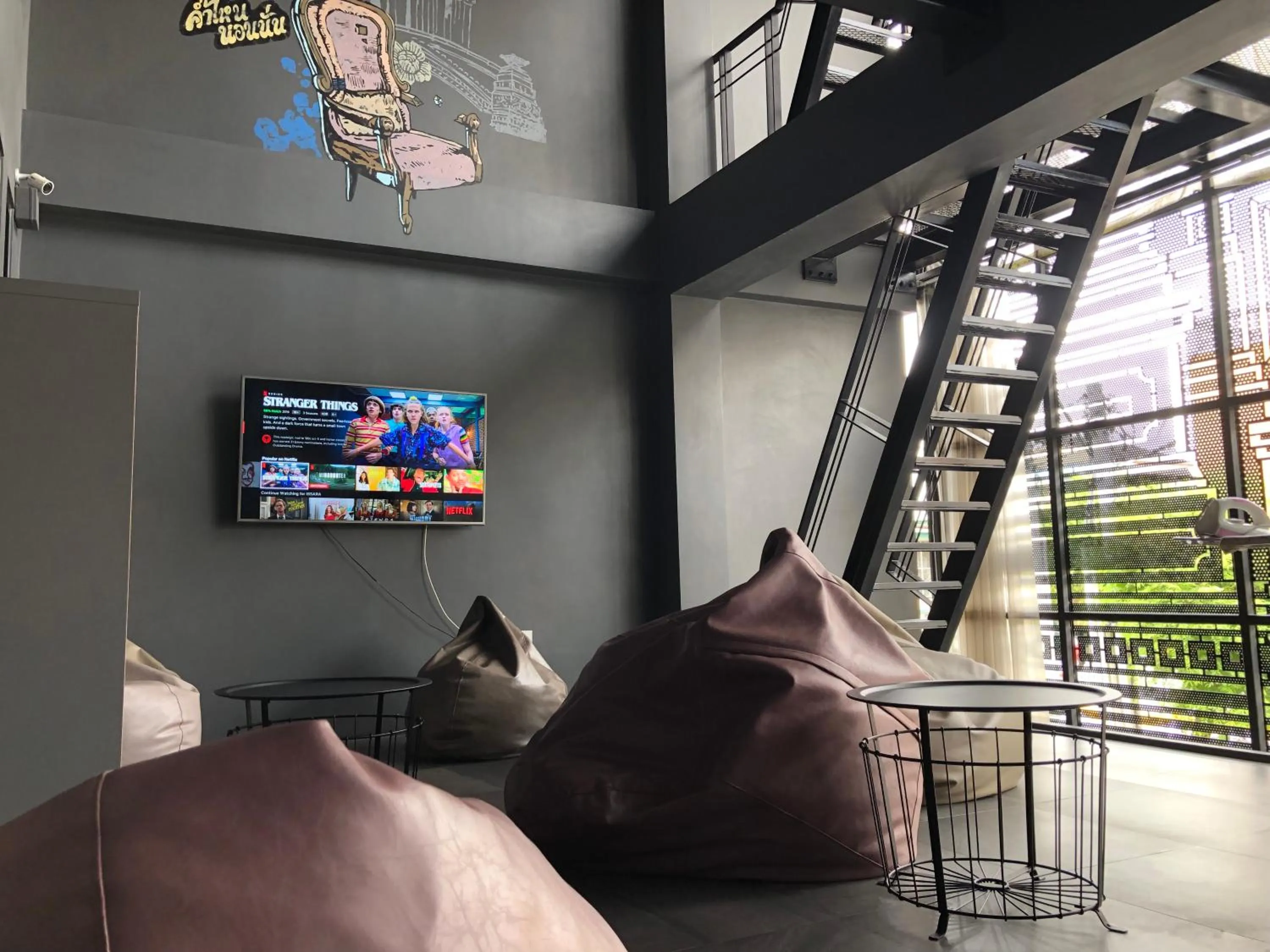 Communal lounge/ TV room in Issara by D Hostel