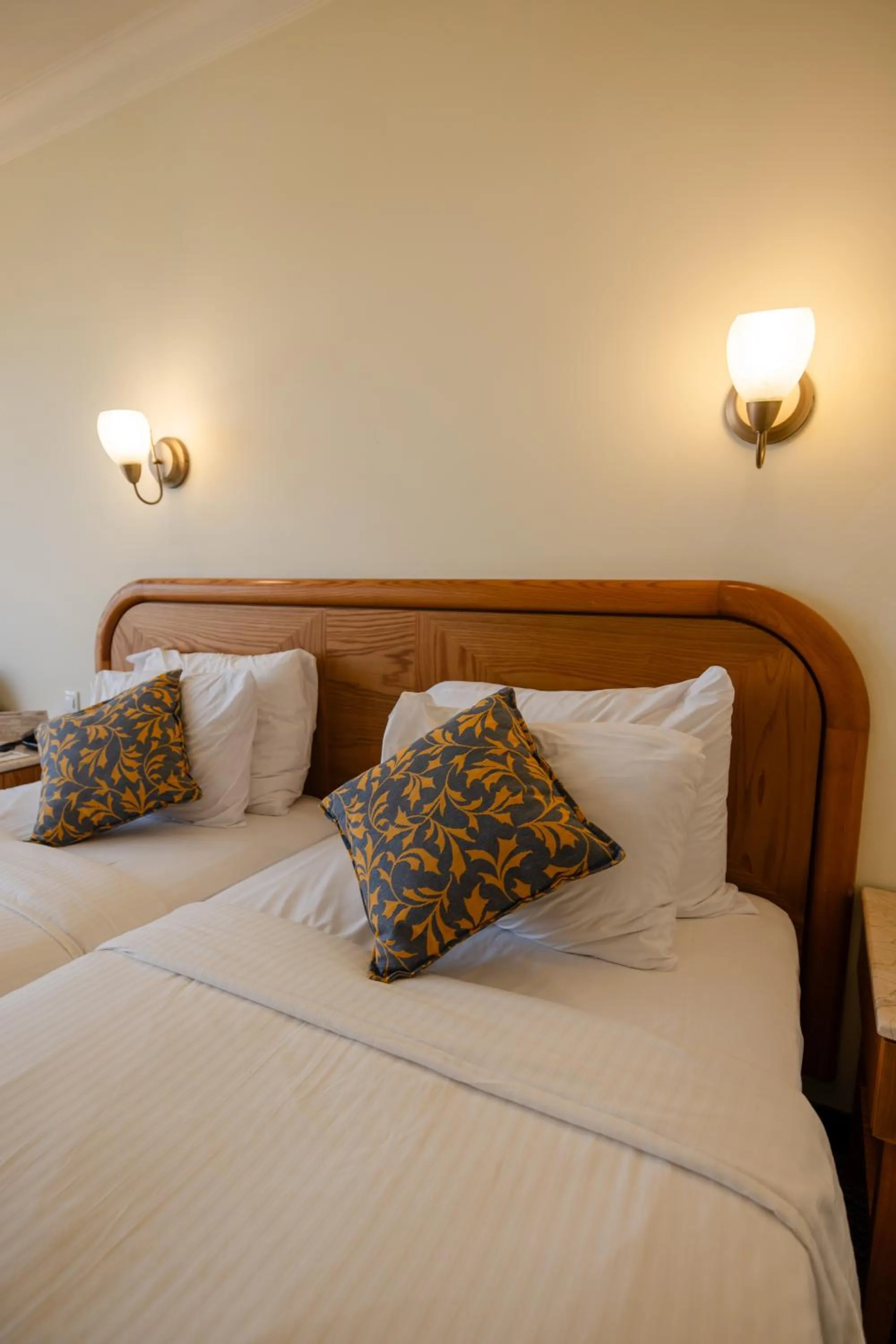 Bed in Grand Court Hotel