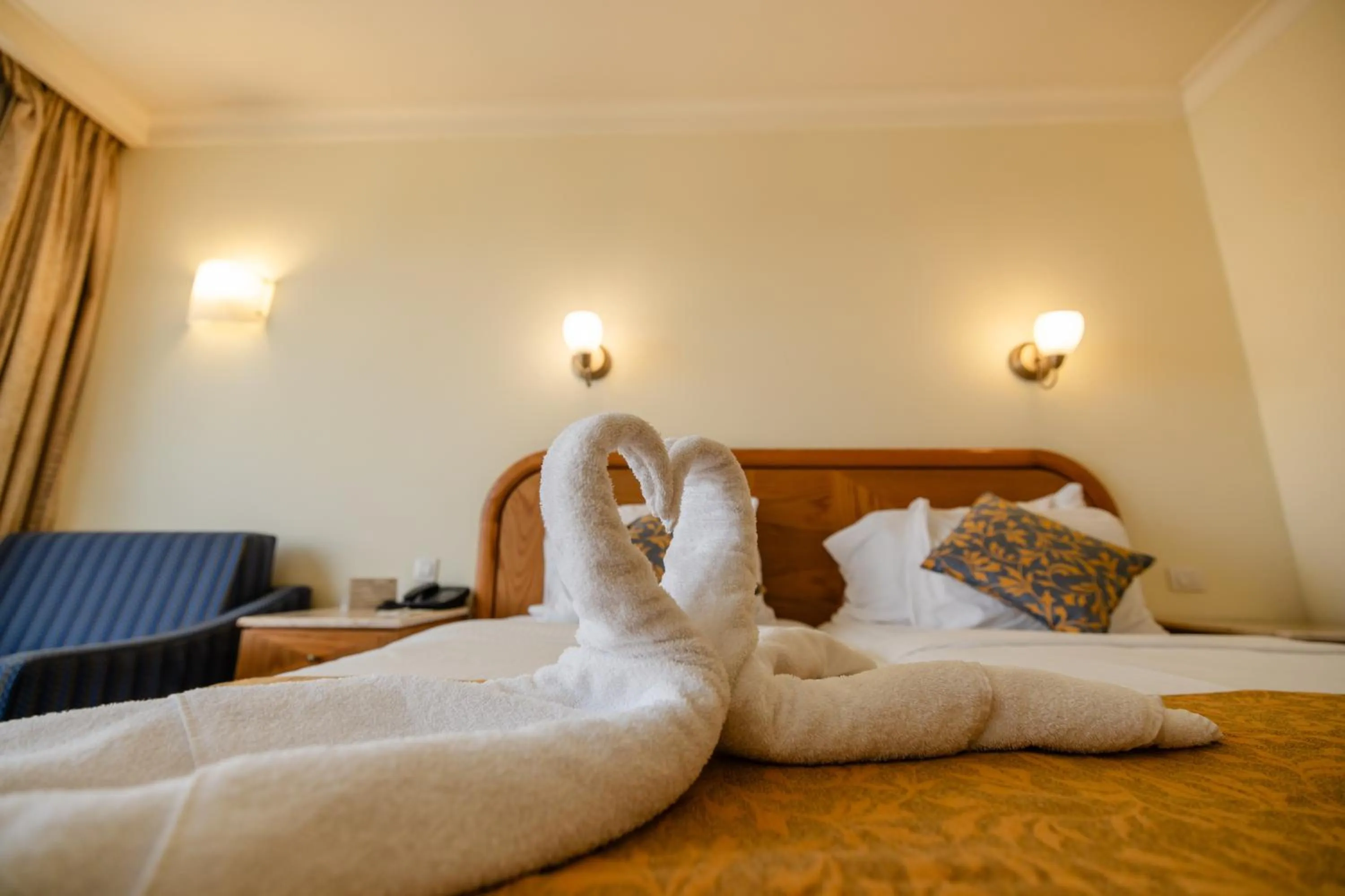 towels, Bed in Grand Court Hotel