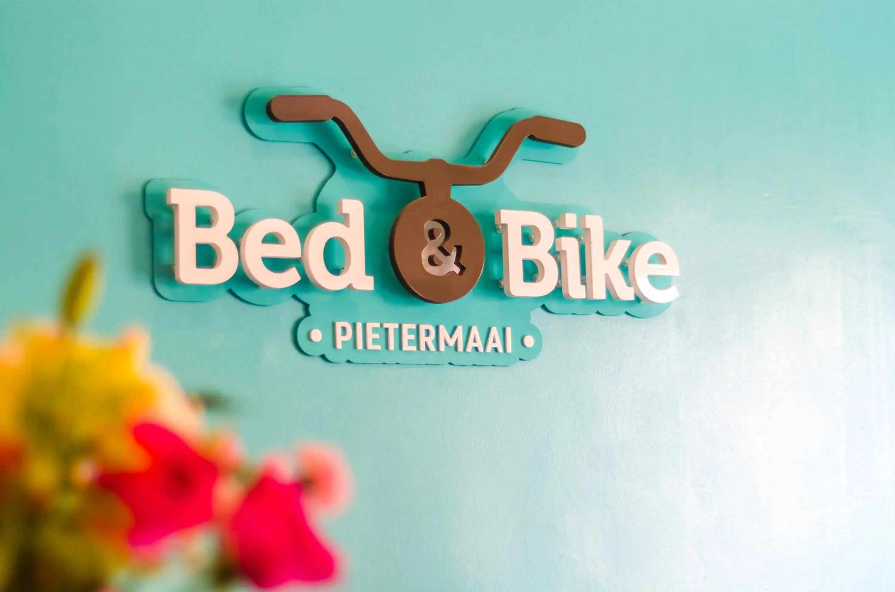 Property logo or sign in Bed & Bike Curacao - Pietermaai